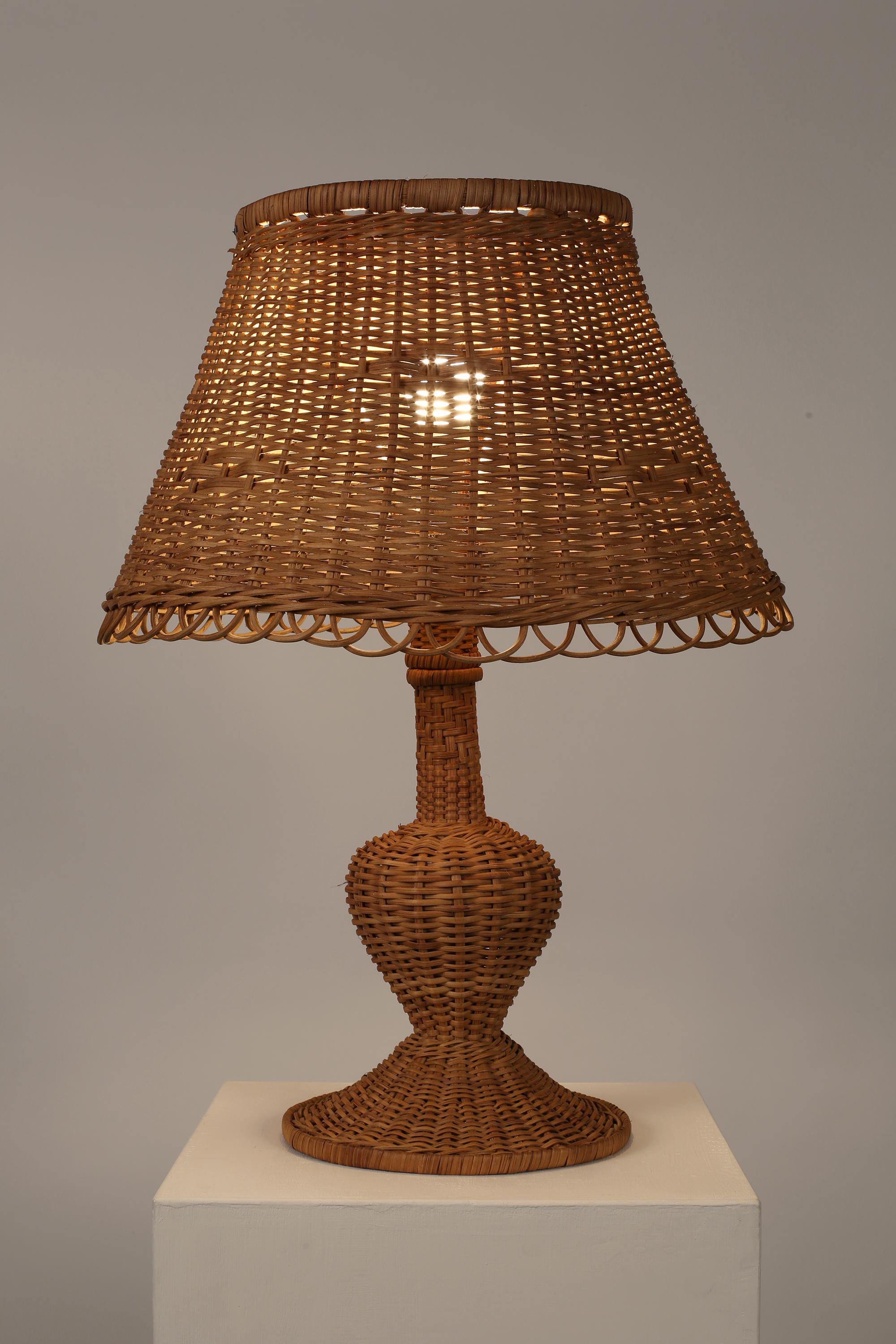 A highly decorative, large-scale woven wicker table lamp from Provence. French, c. 1960s.