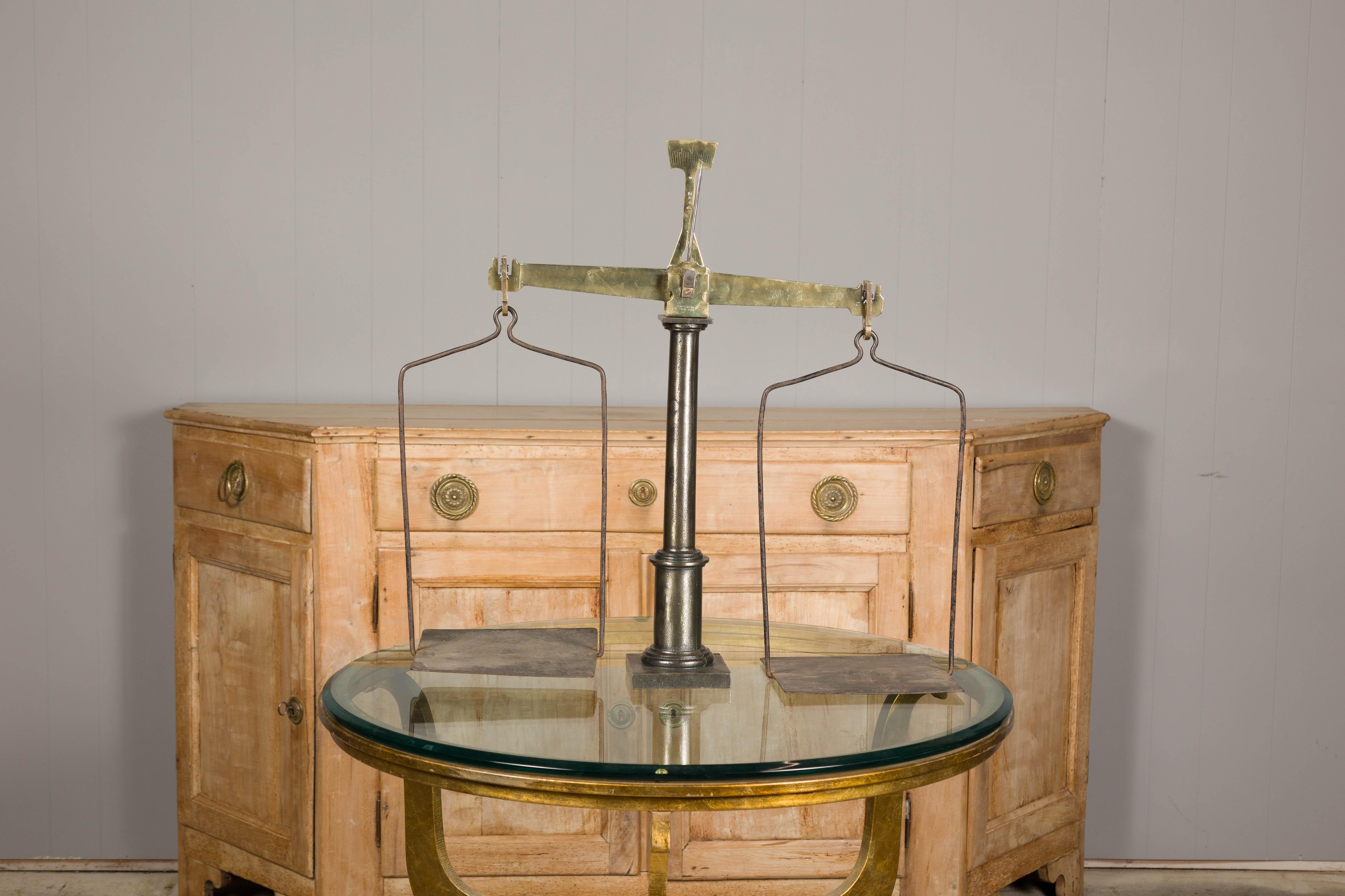 Large French 19th Century Brass and Steel Scale with Weighing Pans and Column In Good Condition For Sale In Atlanta, GA