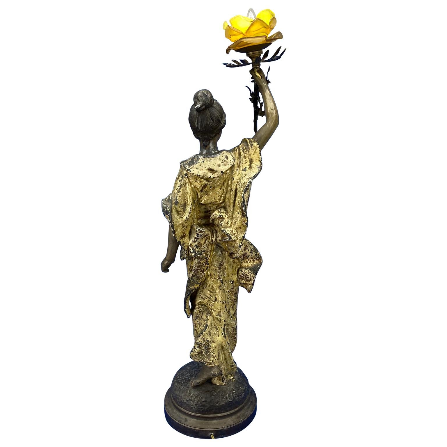 Large French 19th century bronze sculpture of lady with a lit yellow rose glass lamp shade, signed by Pedro Riqual.
