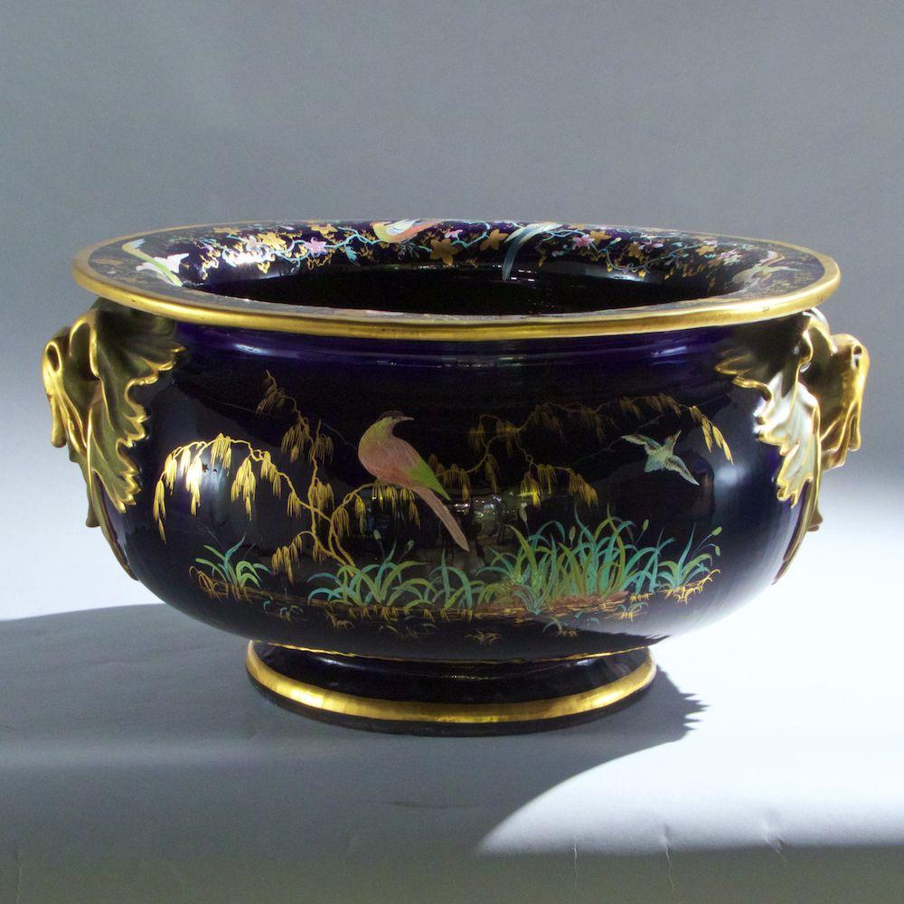 Very large and exceptional Aesthetic period planter of the finest quality with enameled birds and butterflies on a cobalt blue ground.
