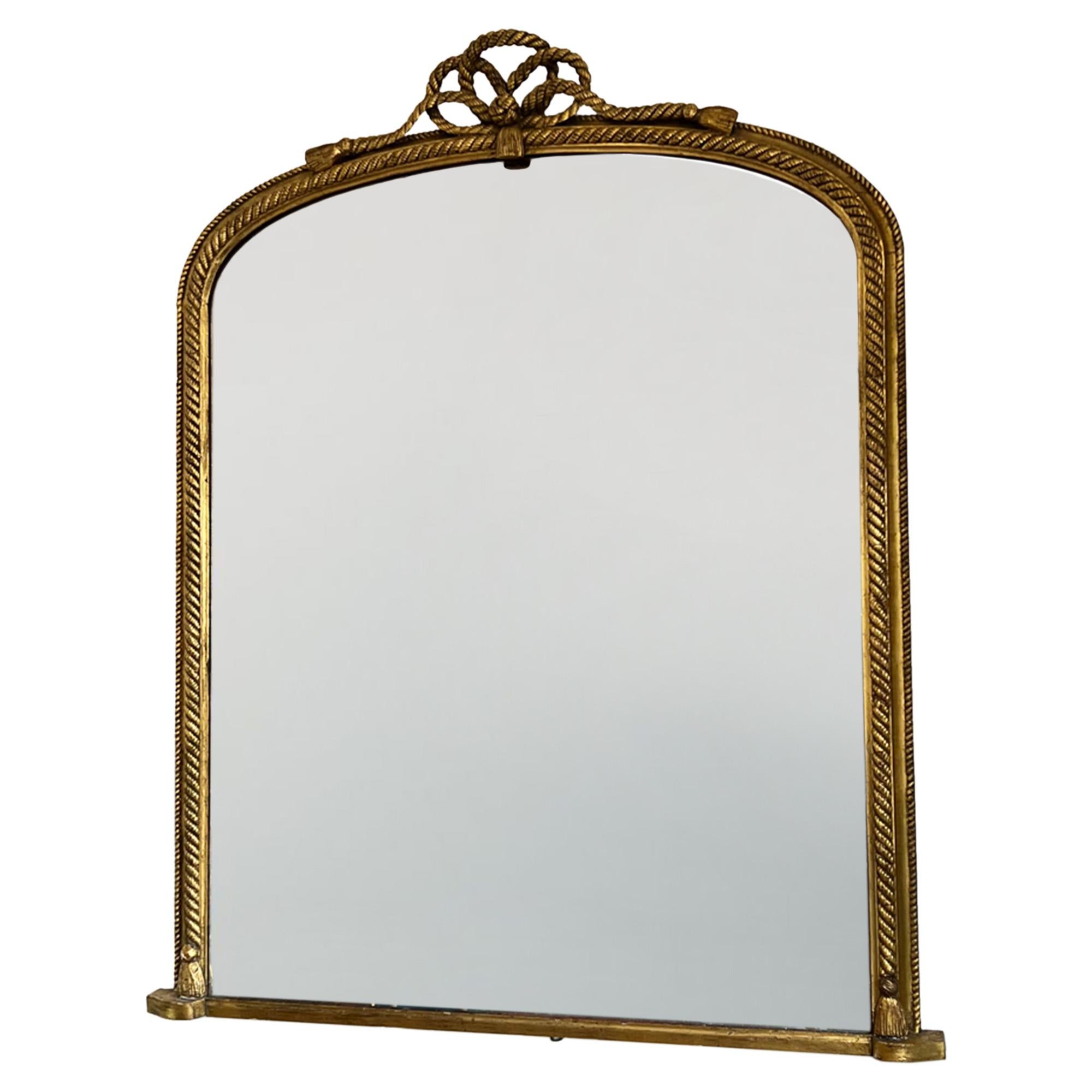 This is a gorgeous giltwood overmantle mirror with the original plate - beautiful mercury glass.

Made in France in the 19th century and it’s big! The lovely rope detail makes this piece really decorative, without being too fussy. 

A great