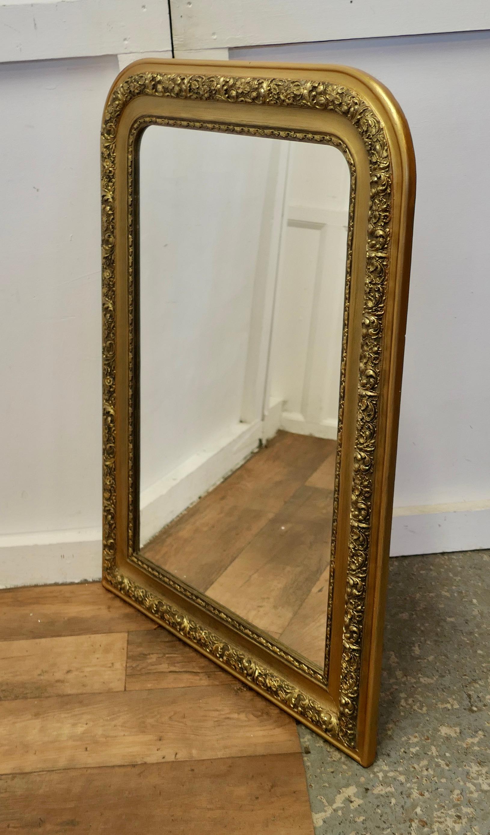 Large French 19th Century Louis Philippe Gold Mirror

This is a very attractive Wall Mirror a genuine example of French antique chic furnishing, the 5” wide mirror frame is very ornate decorated with flowers, and the glass is good
The frame has had