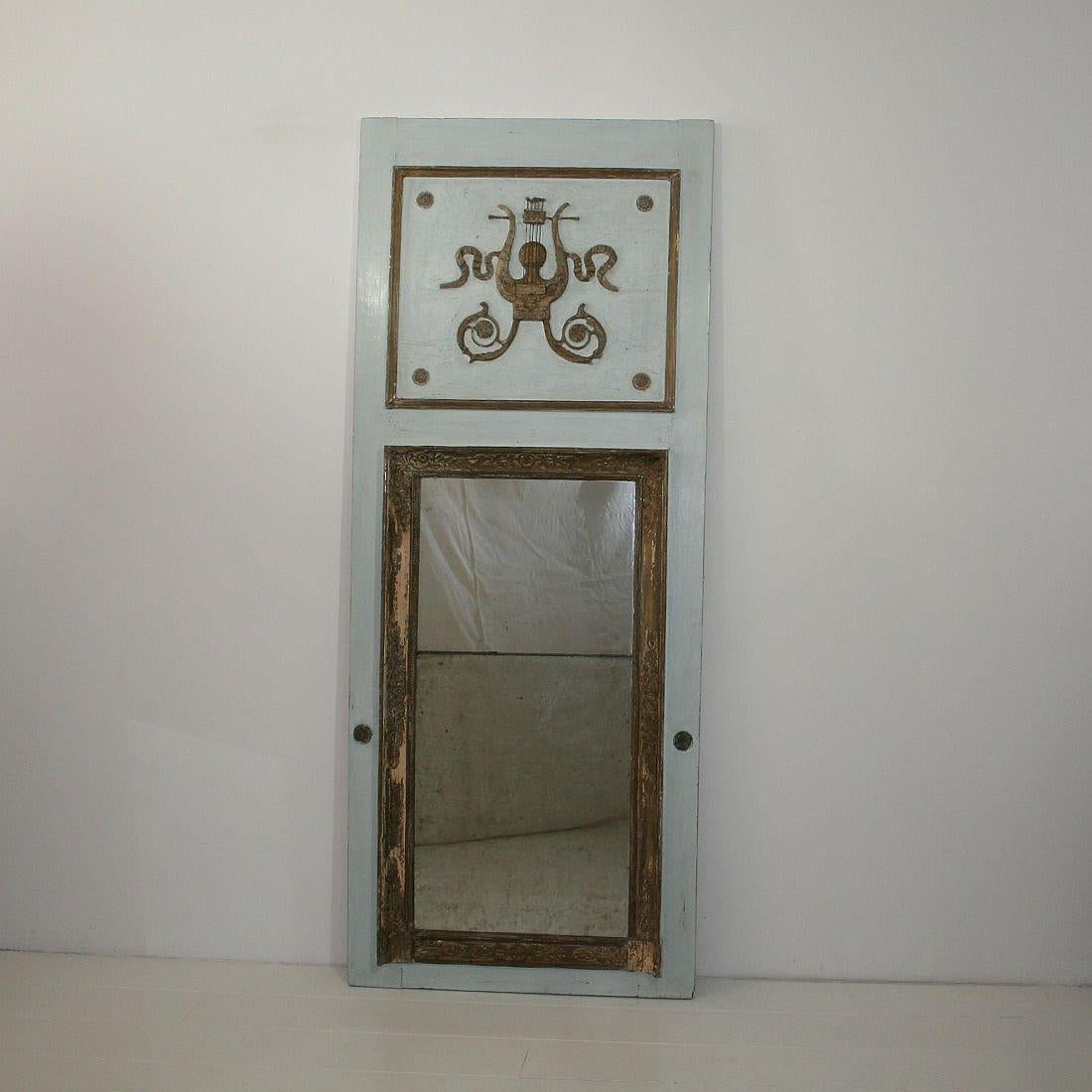 Great period piece with original mirror-glass. They used two mirrors because at this period mirror glass was very expensive and very hard to make in larger sizes. Great patina of several layers of paint that give this mirror the typical French