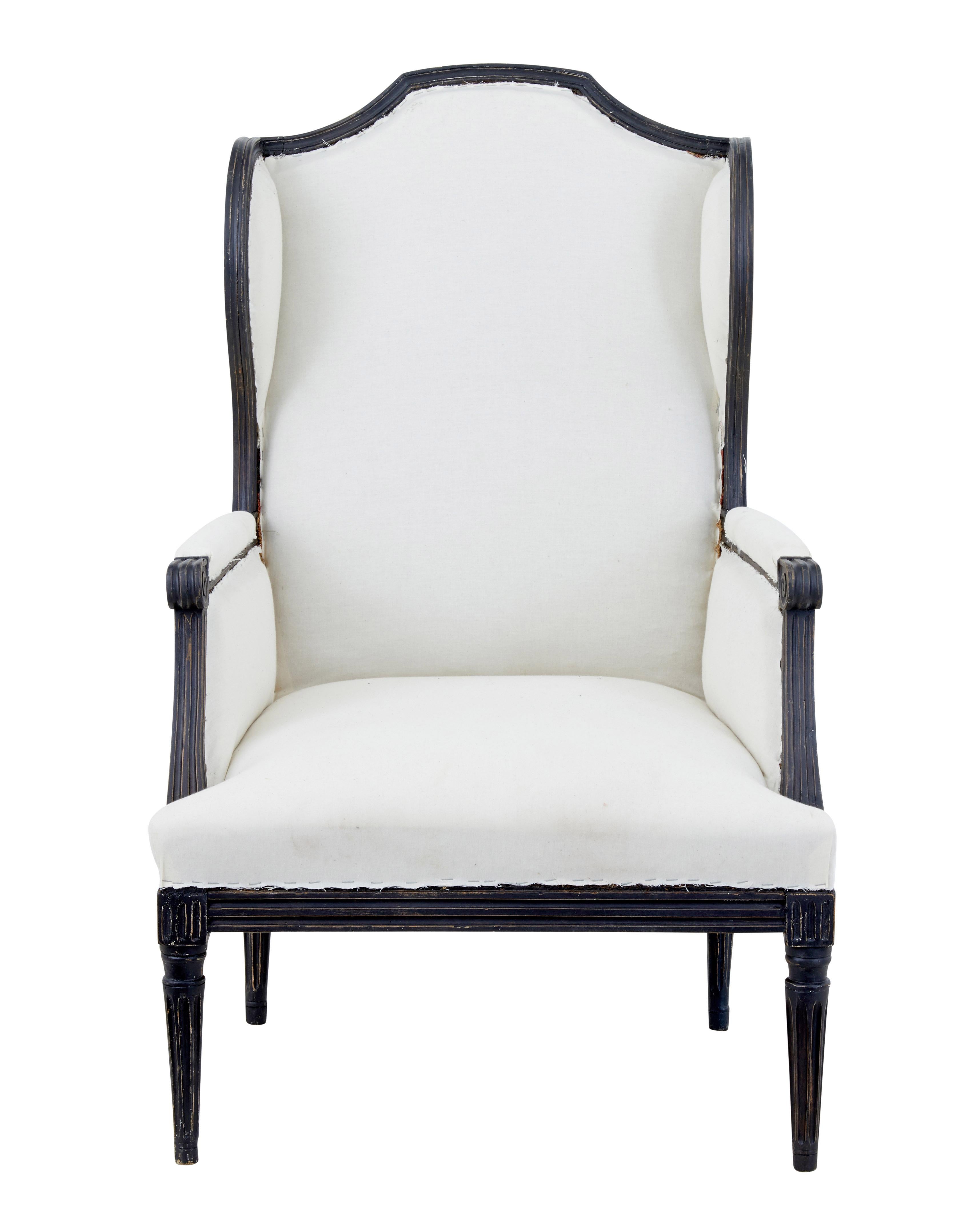 Large French 19th century painted wingback armchair, circa 1880.

Fine 19th century wingback armchair of large proportions.

Very comfortable chair with elegant lines. Carved scroll arms, standing on fluted tapering legs.

Upholstery in good