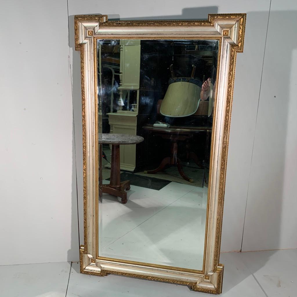 This is a very decorative and unusual French late 19th century silver and gilt mirror with its original bevelled mirror glass, all in good condition.
The mirror can be hung either way, portrait or landscape.
Silver and gilt mirrors are tricky to