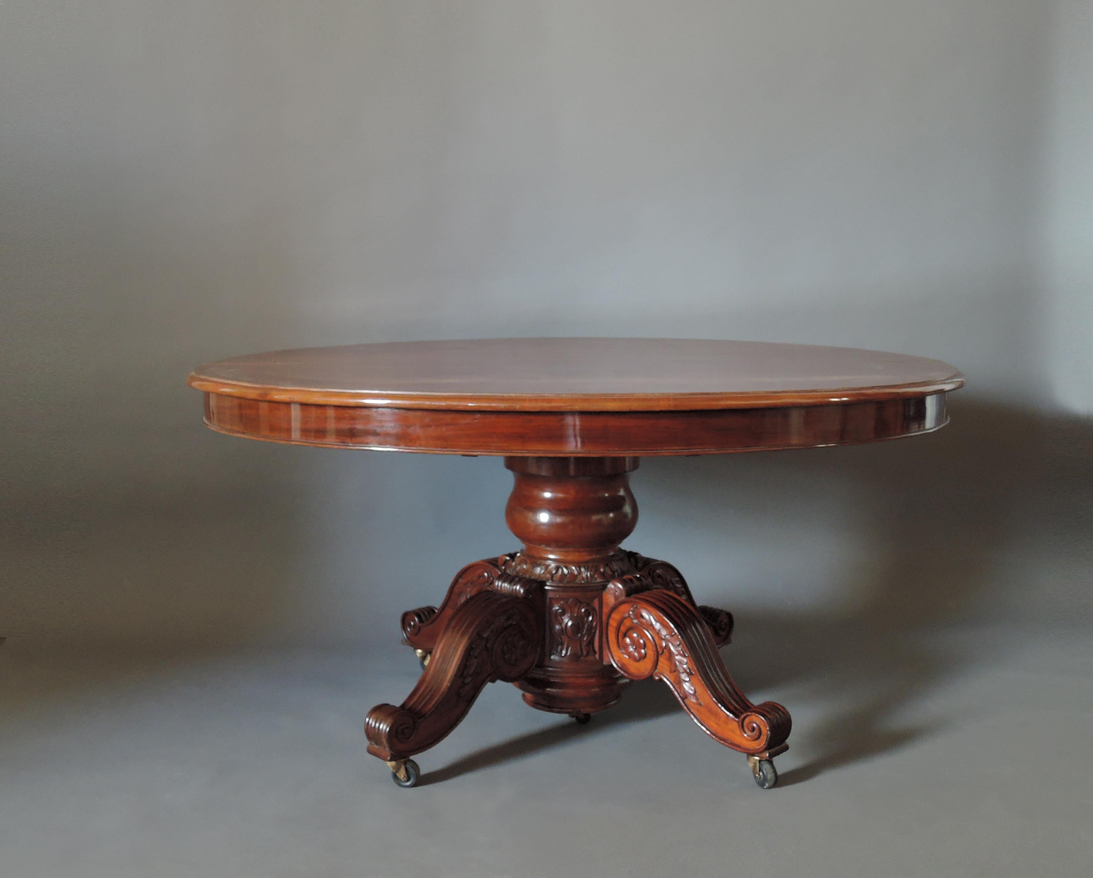 Exceptional large French Restauration period - 1815-1830 -  solid mahogany carved pedestal oval table.
5 leaves  (have been remade in the 20th century).
Extend up to 145 inches with the leaves.
