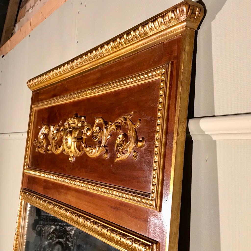 A fantastic quality and unusual French 19th century parcel gilt Trumeau mirror with a walnut frame and original glass.
This is a large mirror, very decorative and a refreshing change from a typical fully gilded mirror.
Ideal as an over mantle