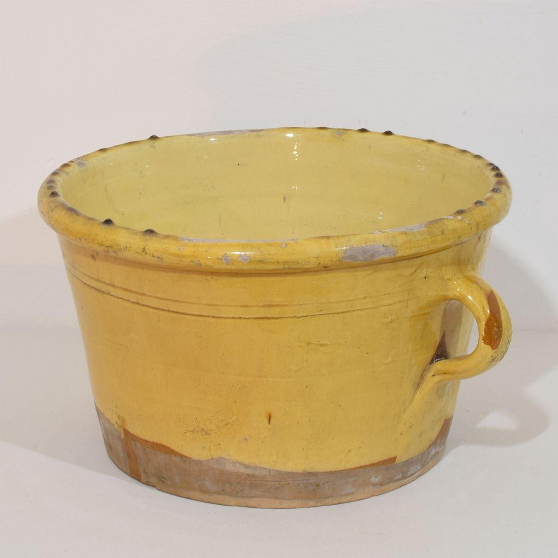 Extremely rare and large French yellow glazed ceramic Kitchen pot. 
Beautiful rich and warm color. 
France circa 1850-1900
Weathered.