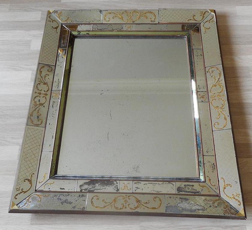 Aged and patinated églomisé mirror, probably made by Max and Paule Ingrand for Jansen, circa 1940.