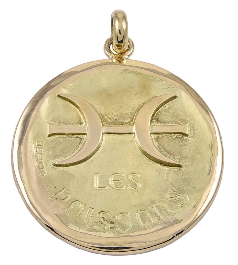 Best ever Pisces pendant.  Very solid gauge 18K yellow gold.  On the front, two well- detailed fish in high relief with a matte finish,  and 