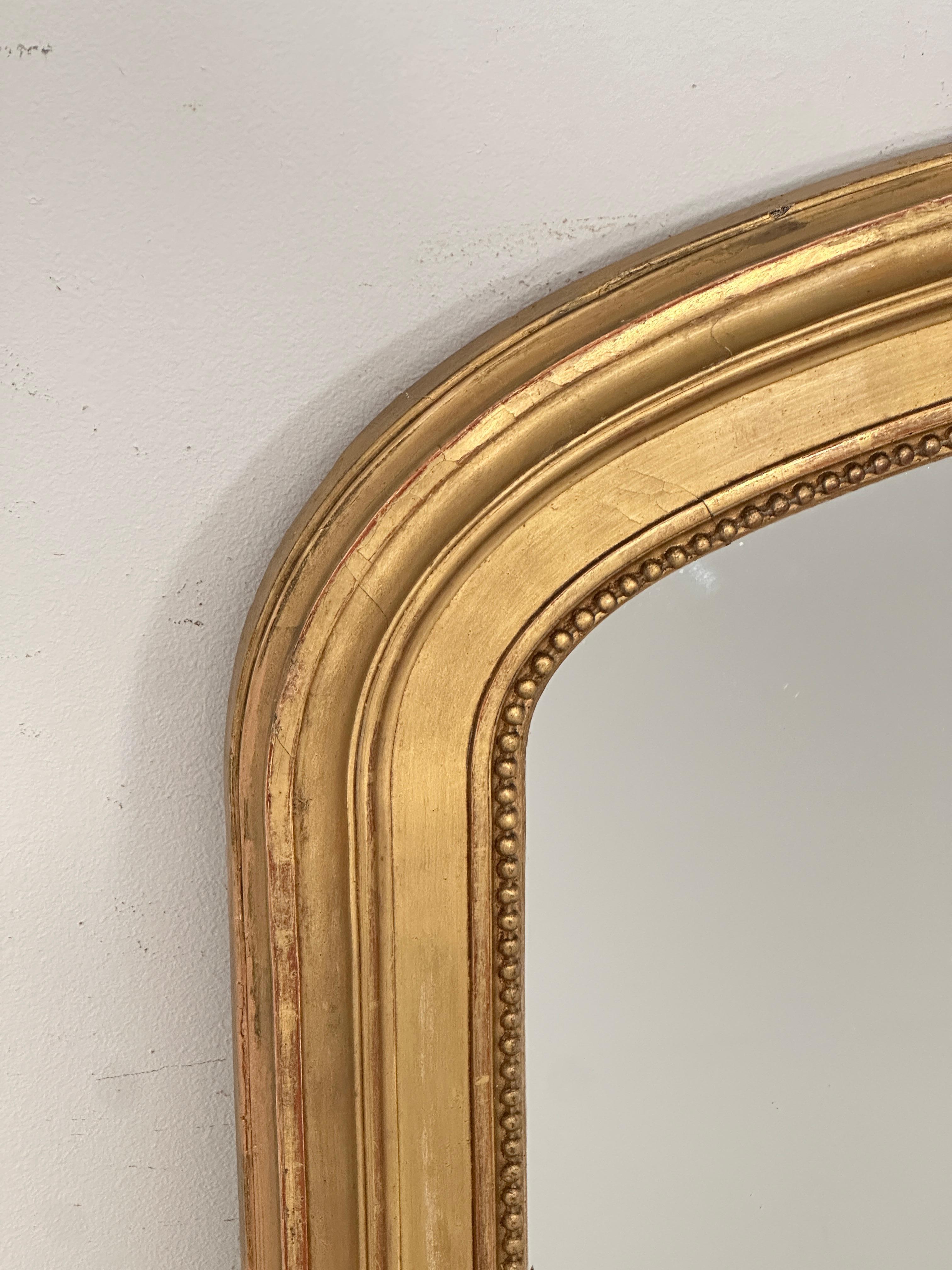 Francese Grande specchio francese ad arco dorato (H. 54 1/4 x L. 32 3/4) in vendita