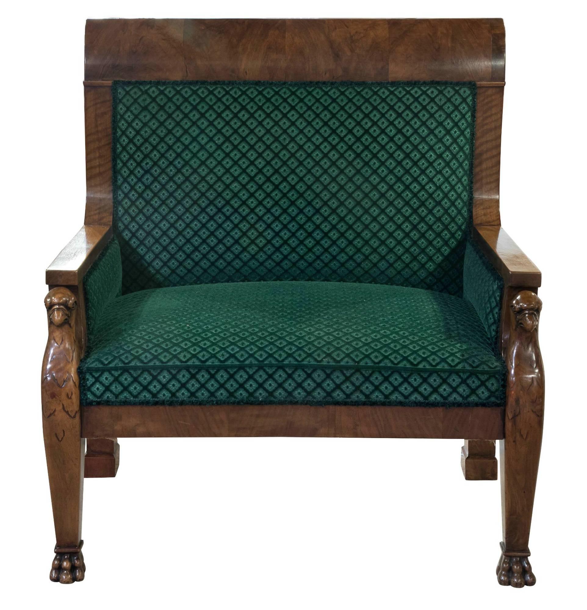 An unusual large French mahogany chair with carved griffen arm supports,

circa 1880.