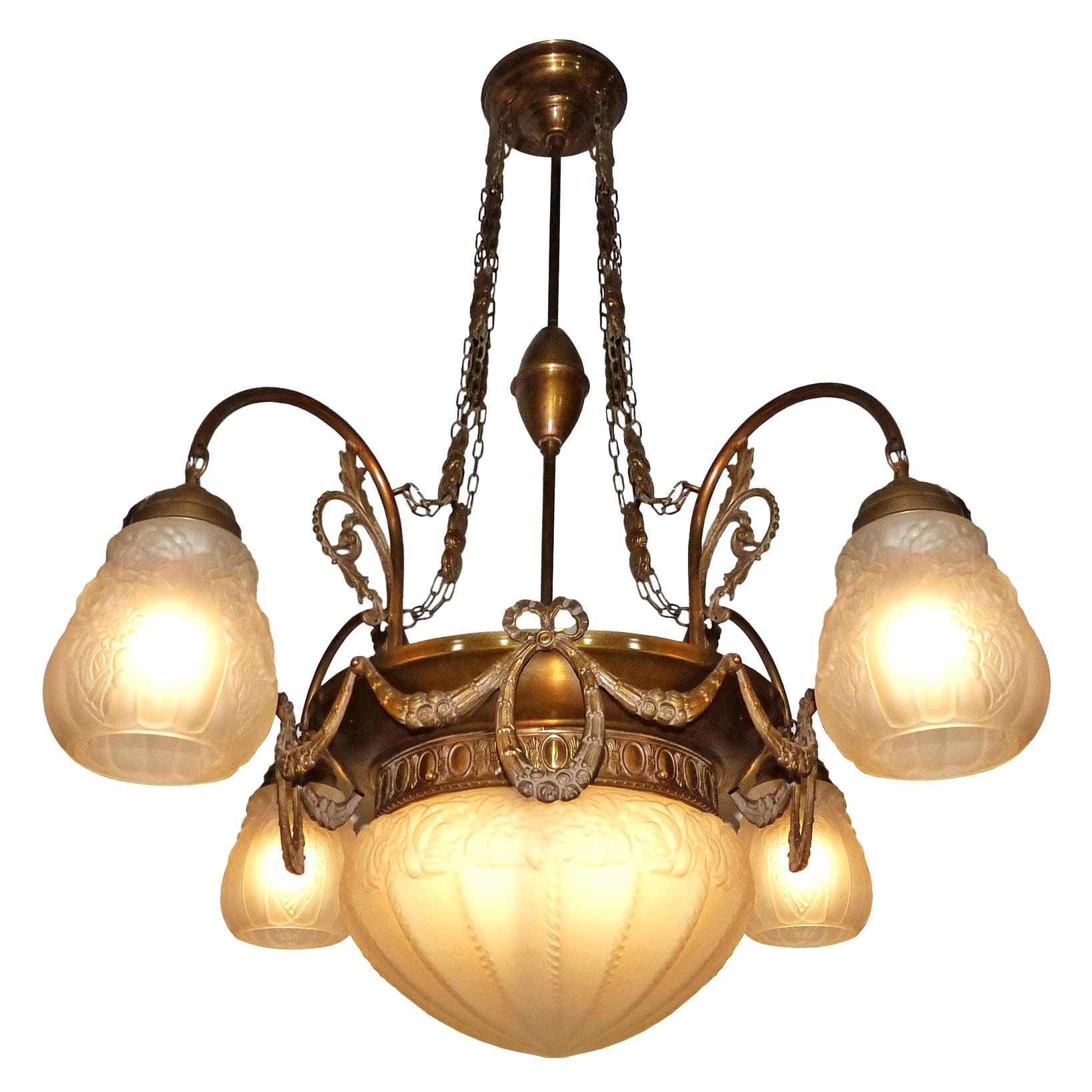 French Art Deco and Art Nouveau in frosted glass, 5-light chandelier/ brass with garlands. 
Age patina
Five light bulbs (four bulbs E14 40W and one bulb E27 60W)
Good working condition
Measures: Diameter 30 in / 75 cm
Height 34 in / 85 cm