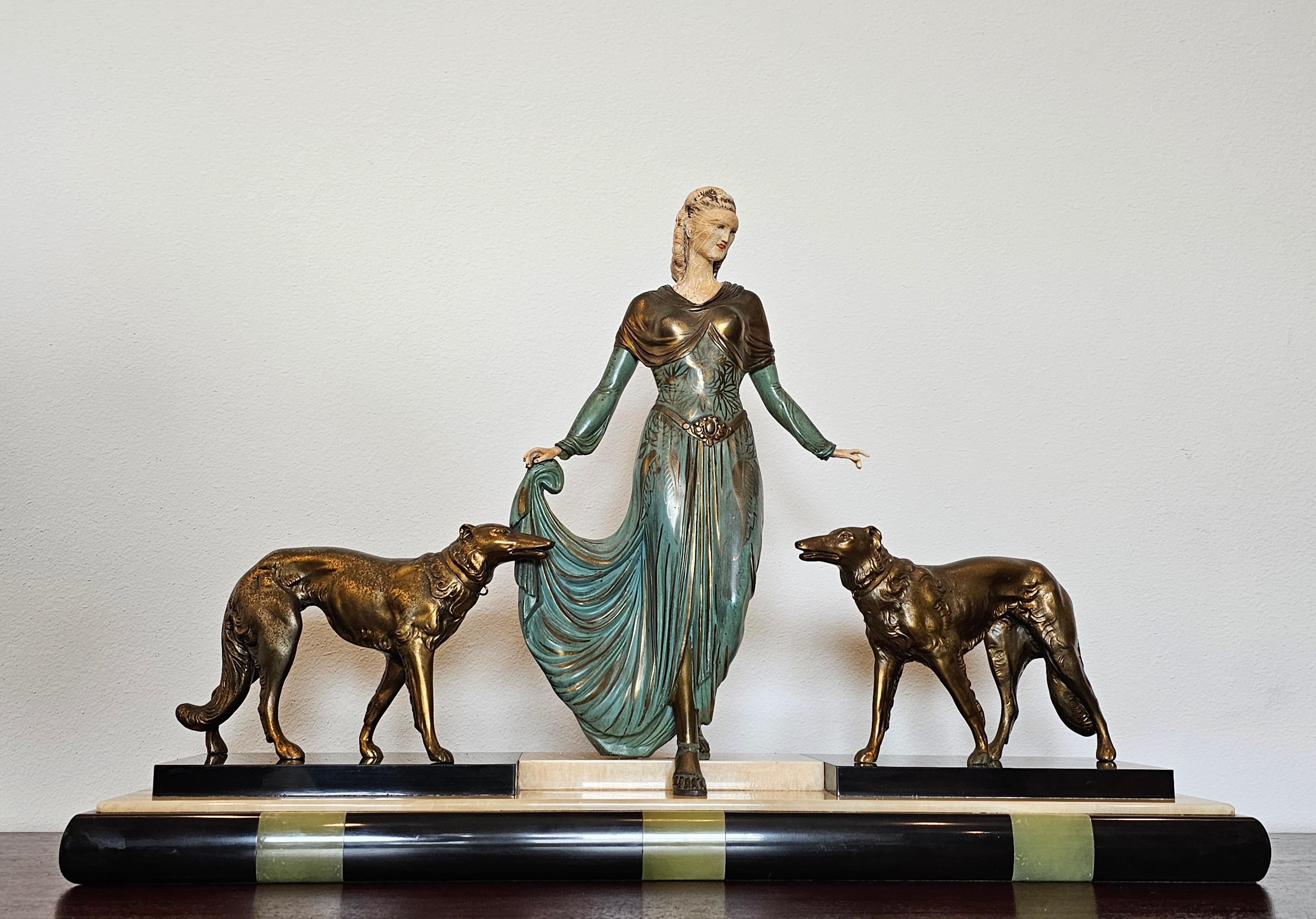 A stunning large French Art Deco sculpture by Georges (J. Roggia) Gori (French, 1894-1944), titled Élégante et Son Chiens, circa 1925-1930

Most impressive work, mixed material including bronze, onyx, and ivorine, exceptionally executed design and