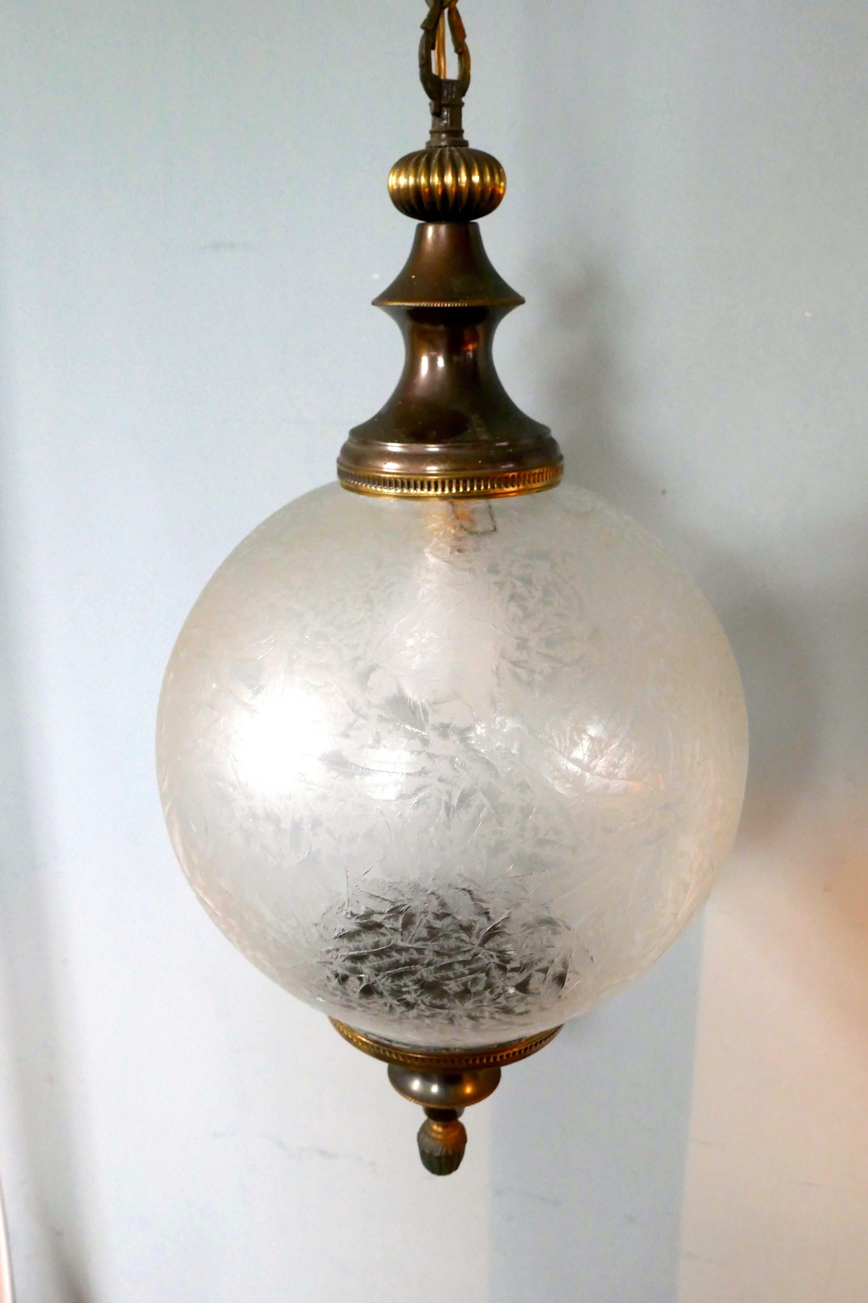 Large French Art Deco globe frosted glass hanging pendant light


Simple and beautiful, this large globe is made with heavy frosted glass and defused the light delicately, it has age darkened brass mounts, rose and chain
The light is in very