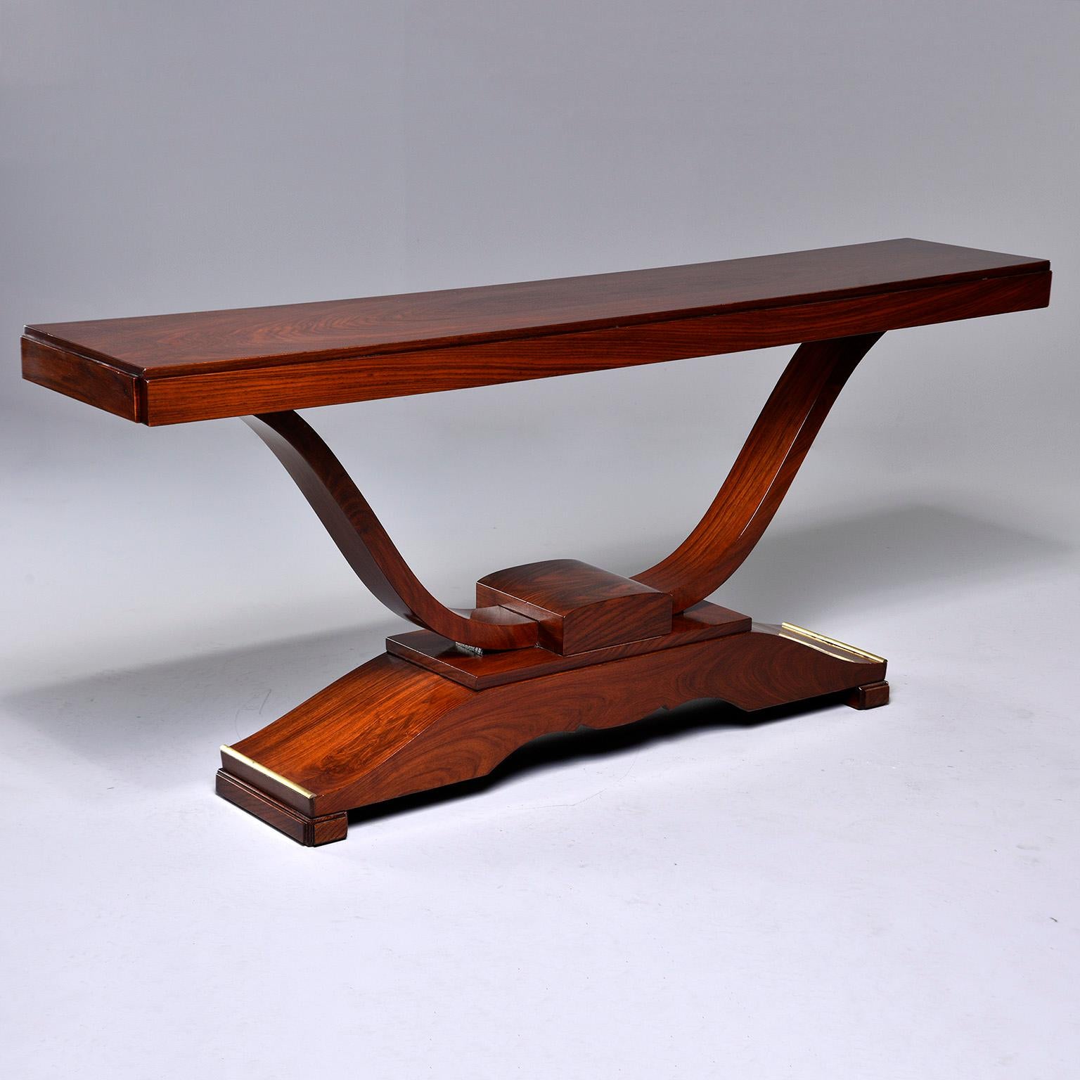 French mahogany console was originally a dining table, but we had the top reduced to be used as a console, circa 1930s. Extra large at just under six feet wide, this is a great piece for a home with larger scale rooms. Classic Art Deco lines, and