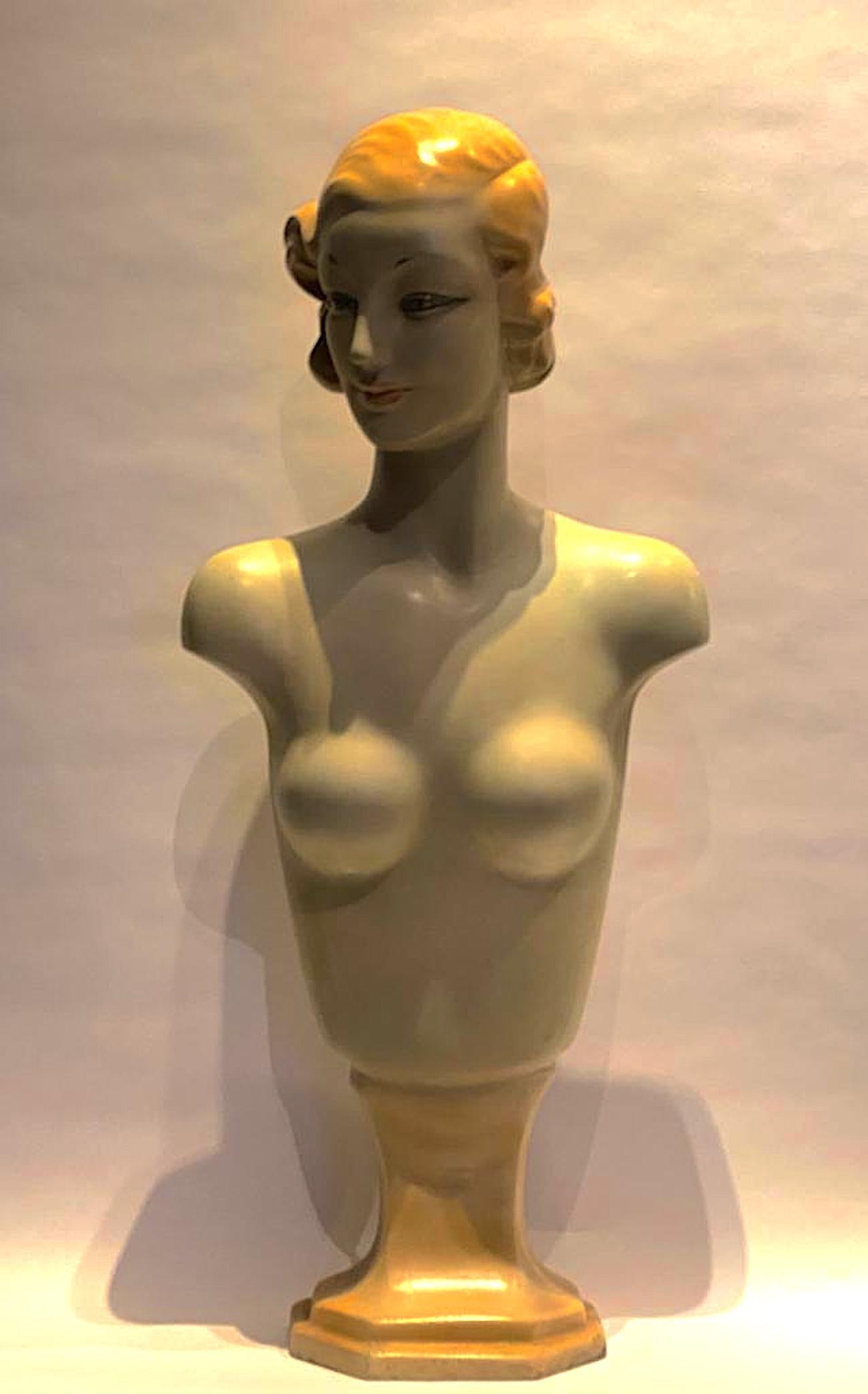 A very large and stunning hand painted French Art Deco necklace and/or camisole display mannequin bust of a chic woman. Her expression is not only one of modest beauty, typical of the day, but also chic and stately. The bust is painted in shades of