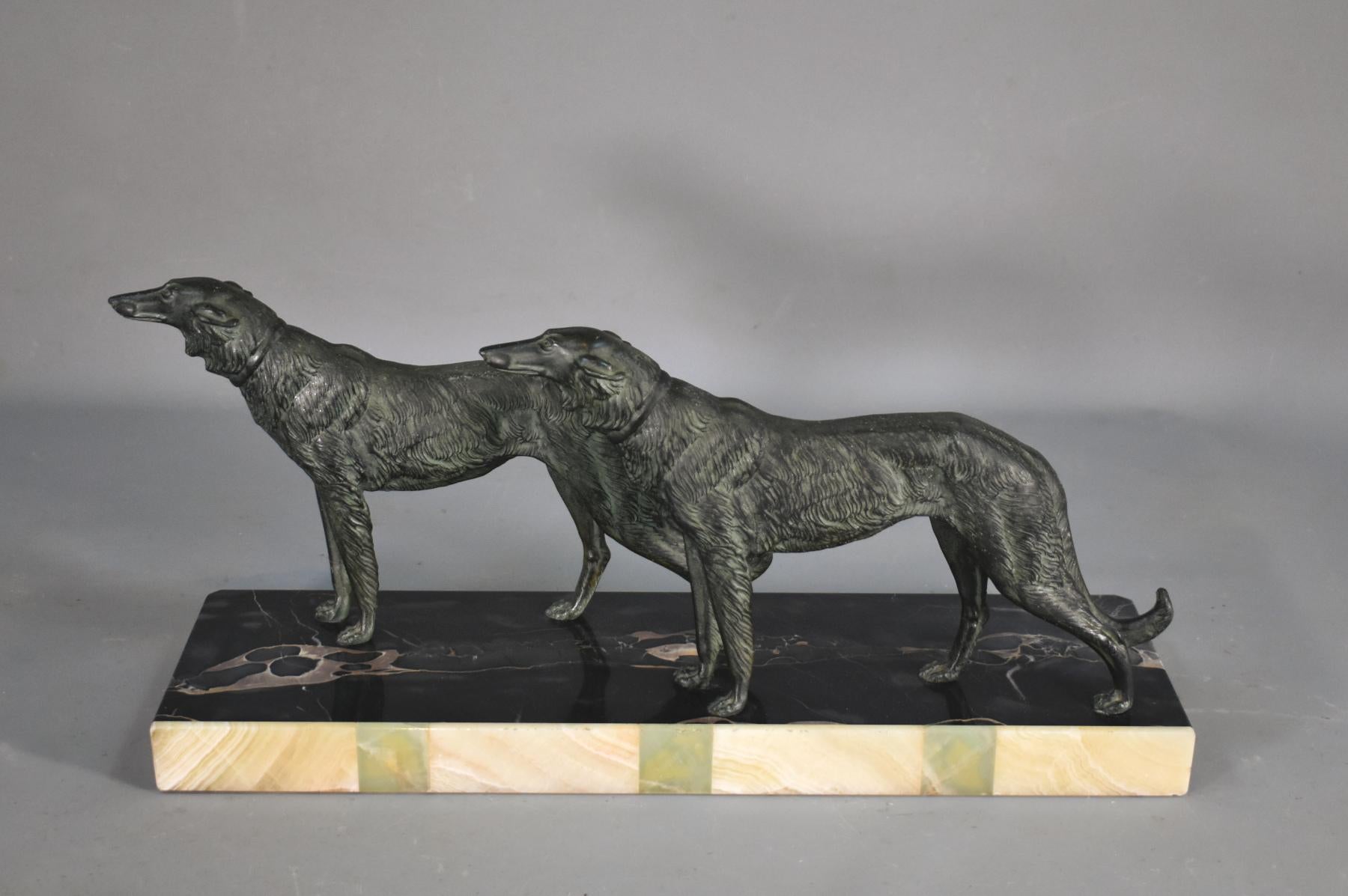 Large French Art Deco Sculpture Borzoi Dogs 

Beautifully cast pair of borzoi dogs with good detail and well-aged patina. 

They are cast in spelter with a cold painted green finish. 

The pair stands on a 40 mm thick portico marble base with