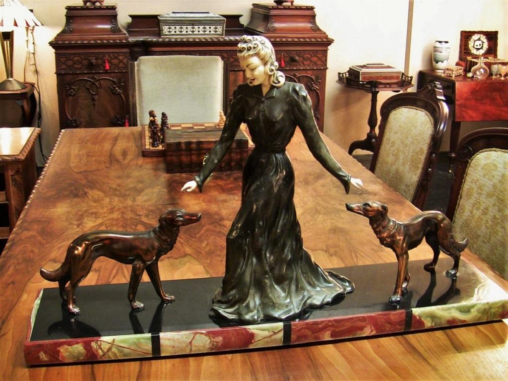 lady with borzois statues