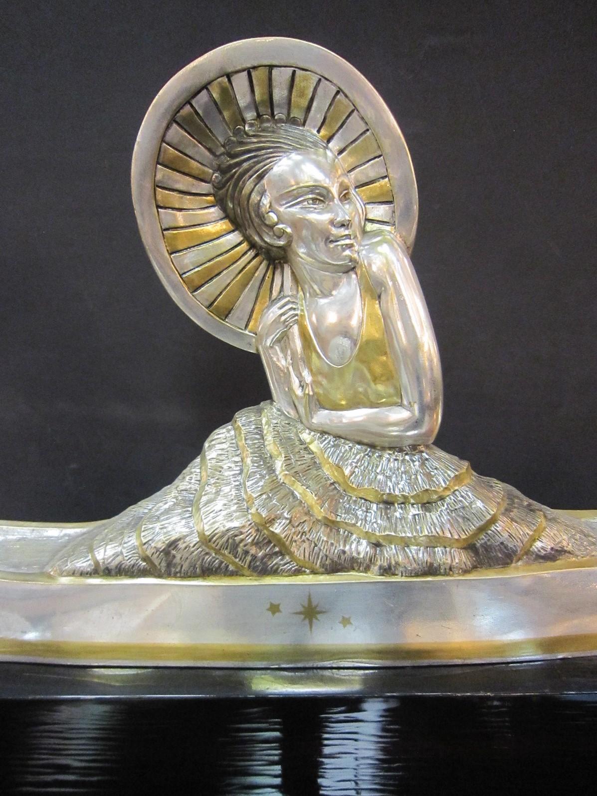 Large French Art Deco Silver and Parcel Gilt Bronze Woman in Canoe, M.L Simard In Good Condition For Sale In New York City, NY