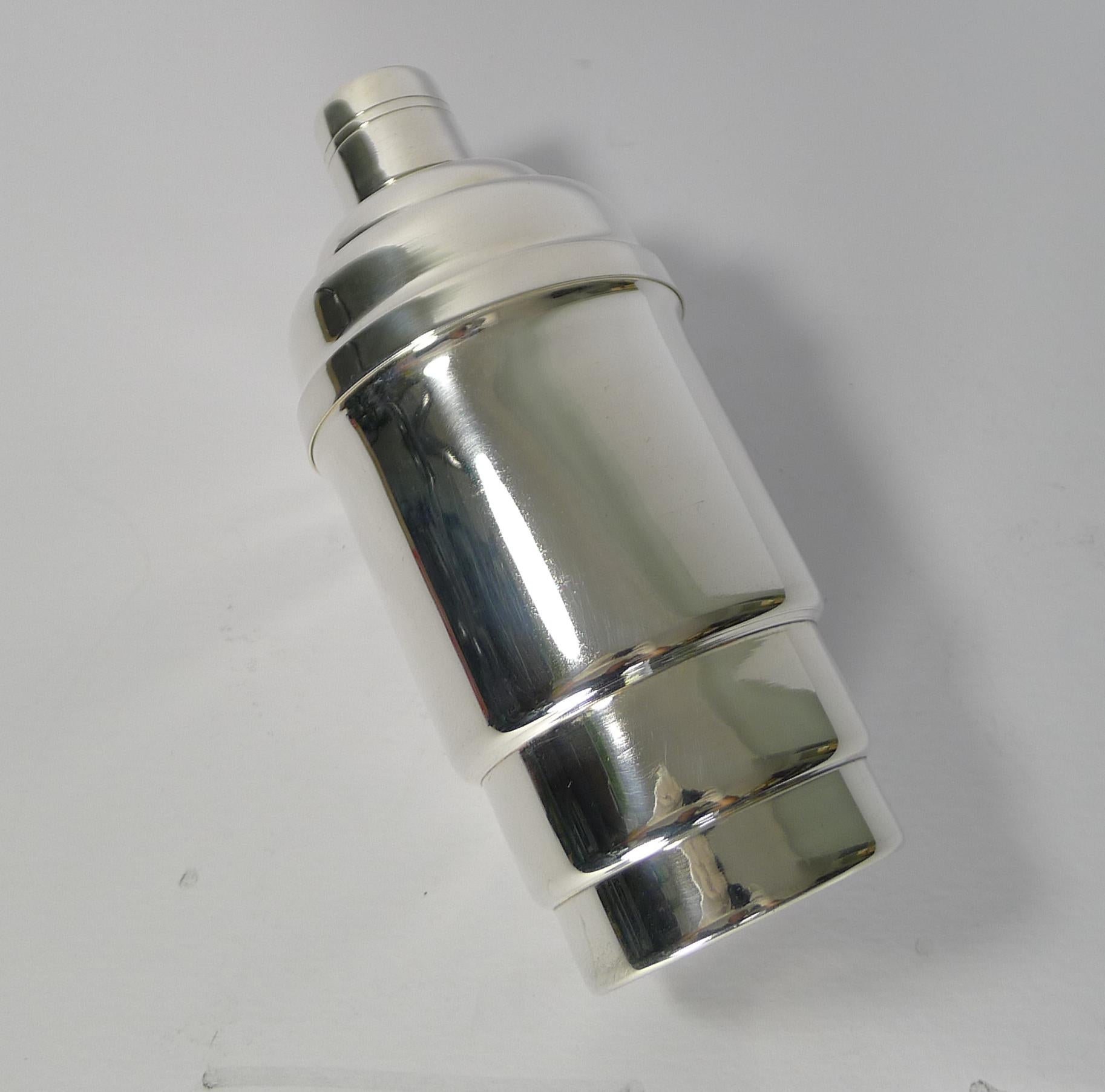An unusually shaped and very handsome Art Deco cocktail shaker dating to the 1930s.

It's fabulous stepped design will look perfect on the most stylish of bars or bar trolleys.

Having just returned from our silversmith's workshop, it has been