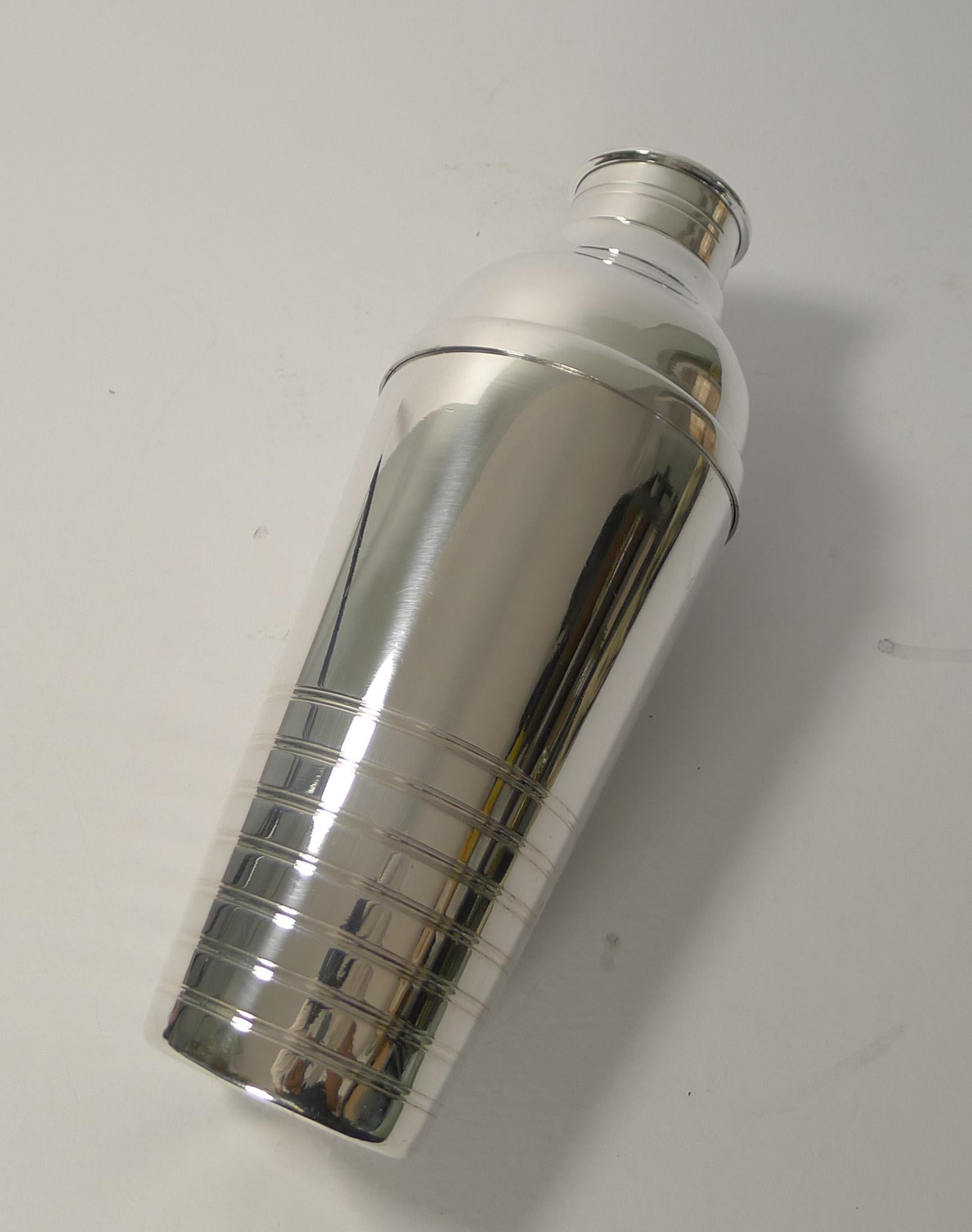 A very grand and tall French cocktail shaker, standing over 10 inches tall.

Silver plated, it has just been returned from our silversmith's workshop where it has been overhauled, professionally cleaned and polished, restoring it to its former
