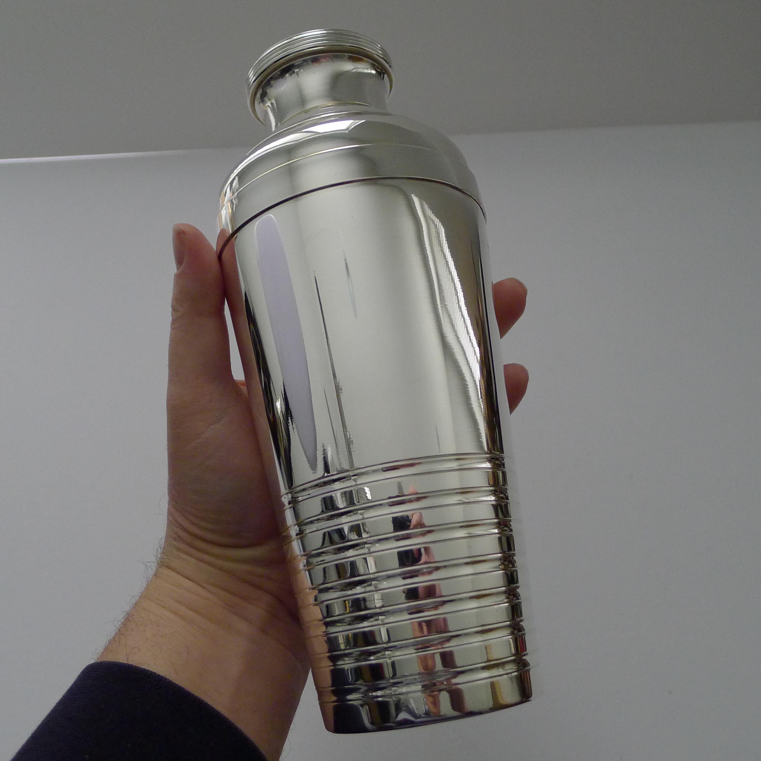 A striking large French silver plated cocktail shaker, Art Deco in era, circa 1940. 

Marked on the underside 