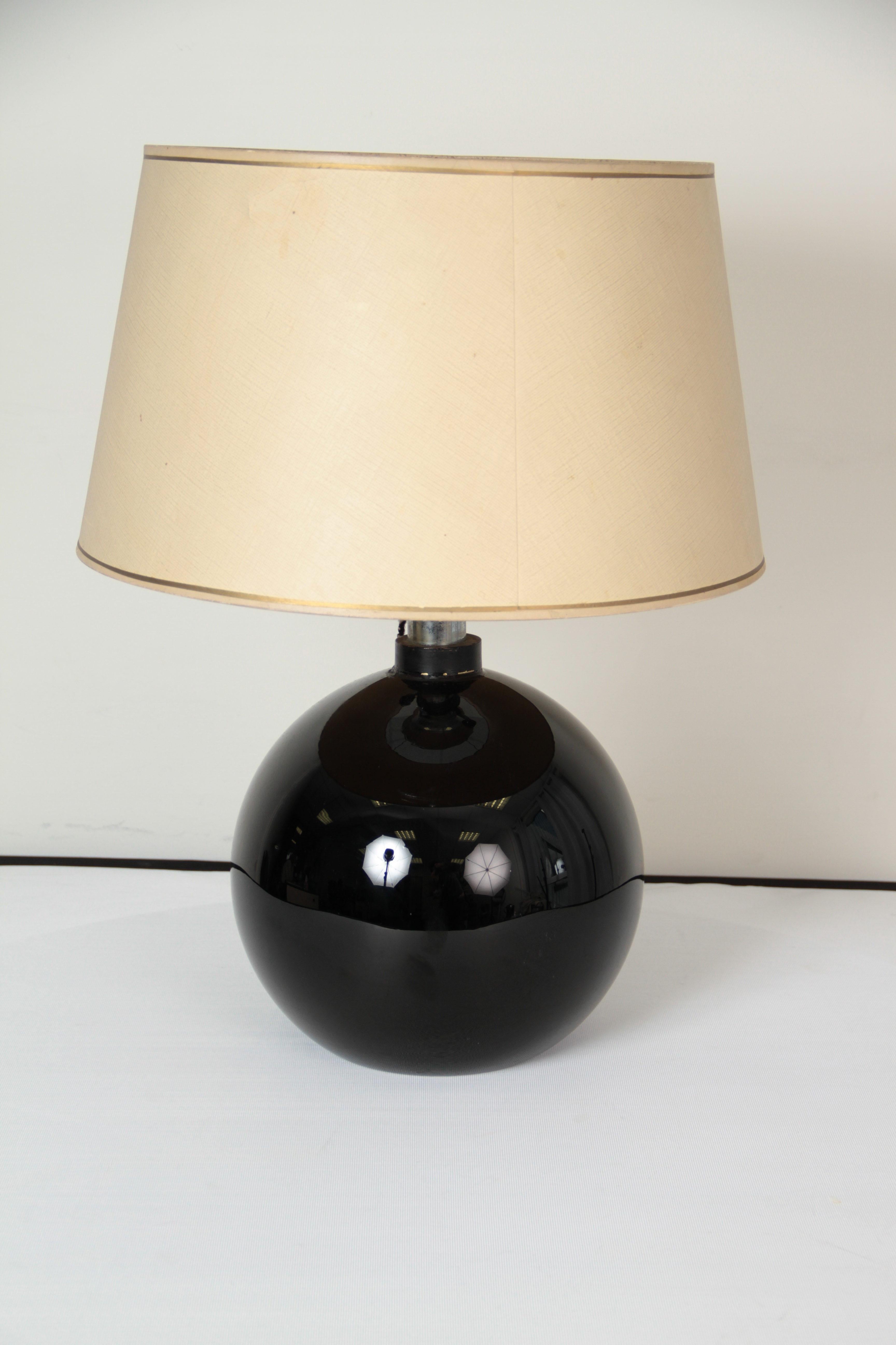 French, circa 1935
Large table lamp
with a large spherical opaline glass base,
the shade revealing tapered conic chromed metal light reflectors with three light fitments.
  