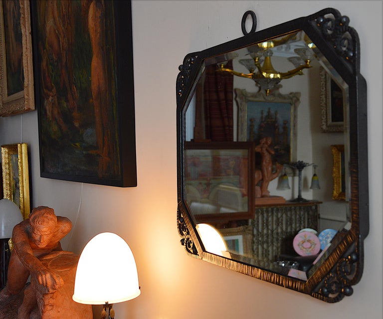 French Art Deco wall mirror, France, 1930s. Wrought iron and mirror. Original beveled glass mirror. Measures: Width 23.4