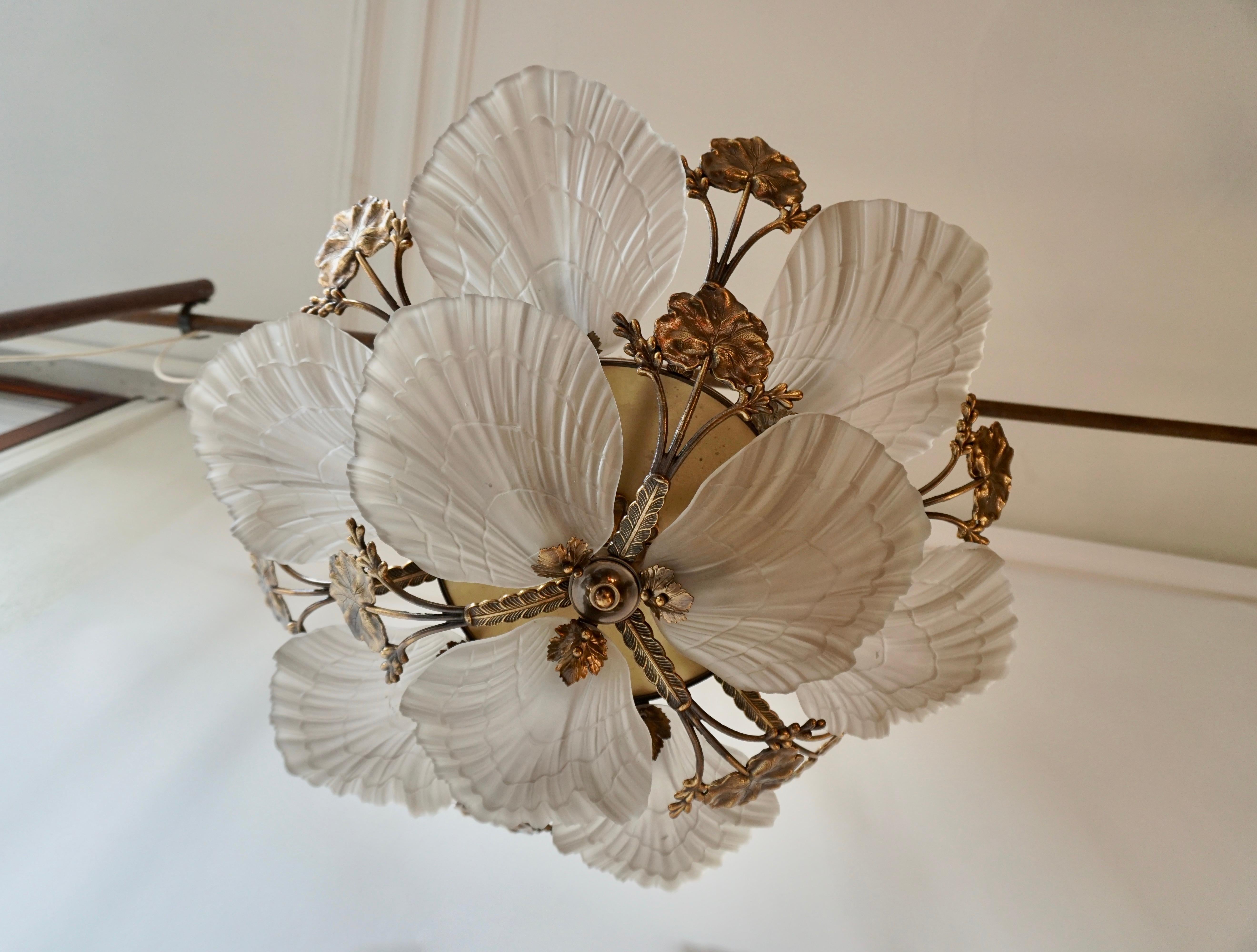Art Nouveau style chandelier or flushmount with petal or shell shaped frosted glass and leaf design in brass.

Measures: 
Diameter 68 cm 
Height 27 cm 
Weight 10 Kg.
  