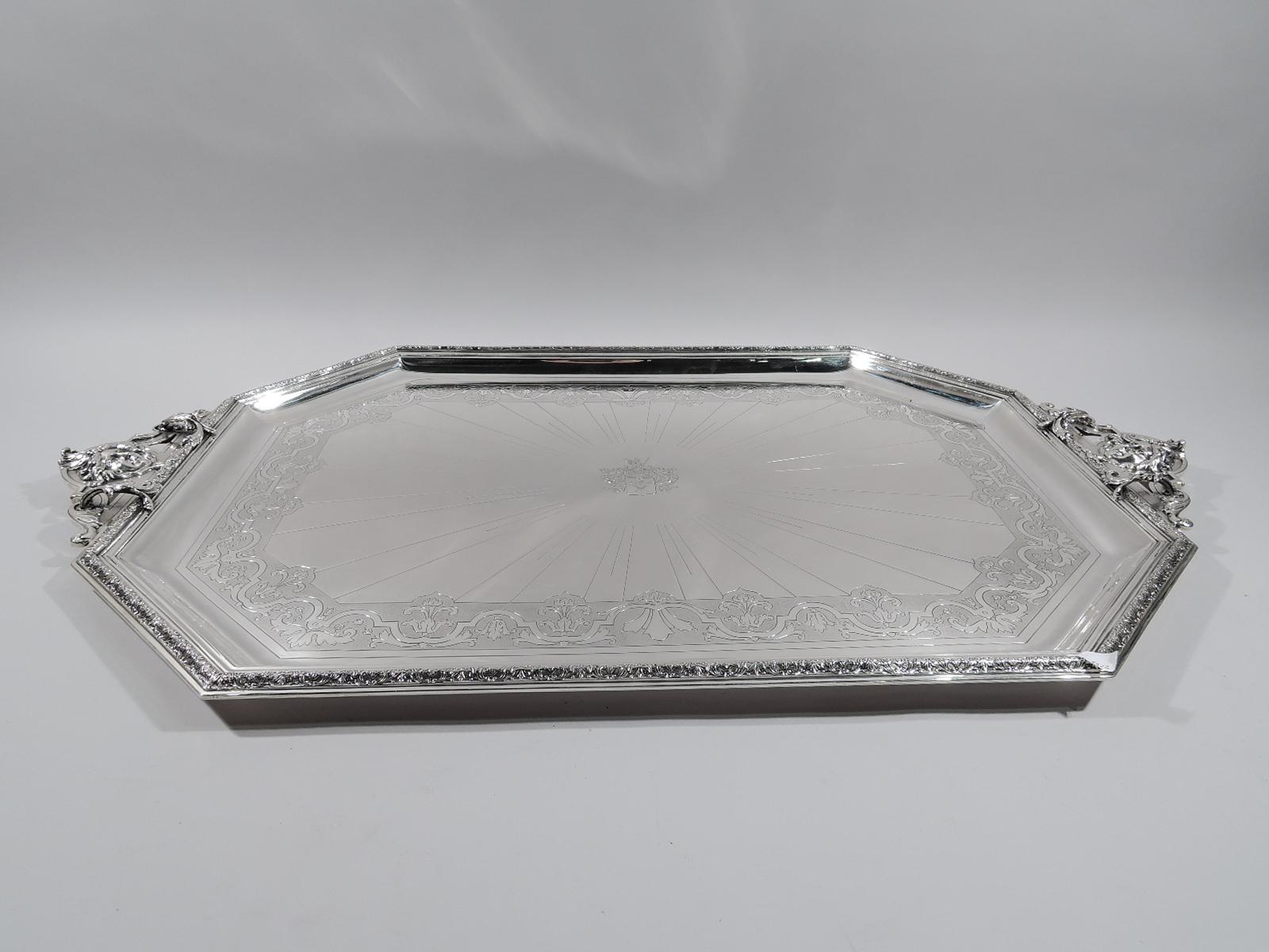 Large Belle Époque classical 950 silver frame. Made by Cardeilhac in Paris, circa 1890. Rectangular with chamfered corners. Raised leaf-and-scroll rim and engraved well: Strapwork on stippled ground surrounding central armorial with radials. End