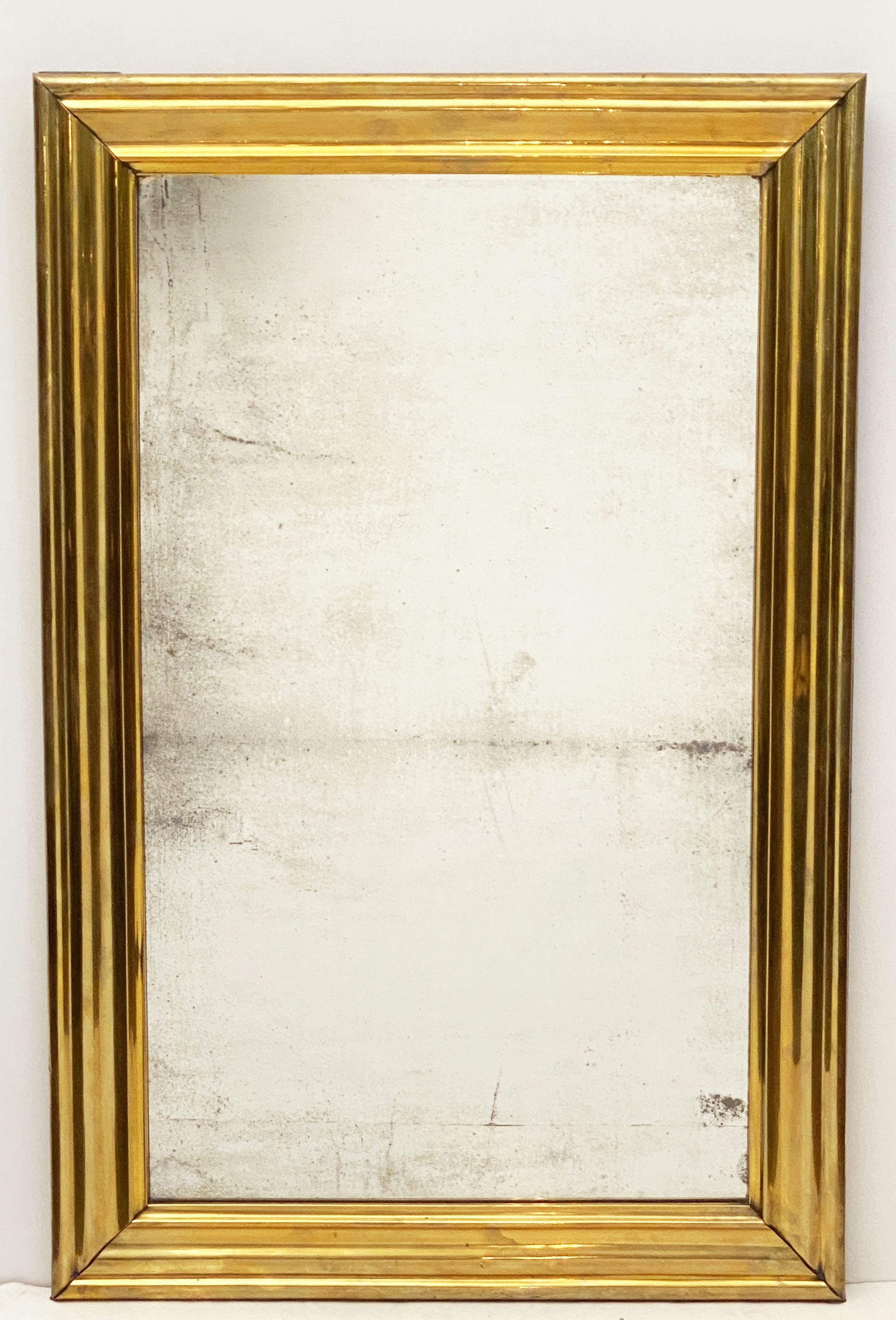 A fine French rectangular bistro mirror of brass clad wood from the Napoleon III era, featuring a stylish frame surrounding the original mirrored glass.

Dimensions are: Height 48 inches x width 31 inches x depth 2 inches.