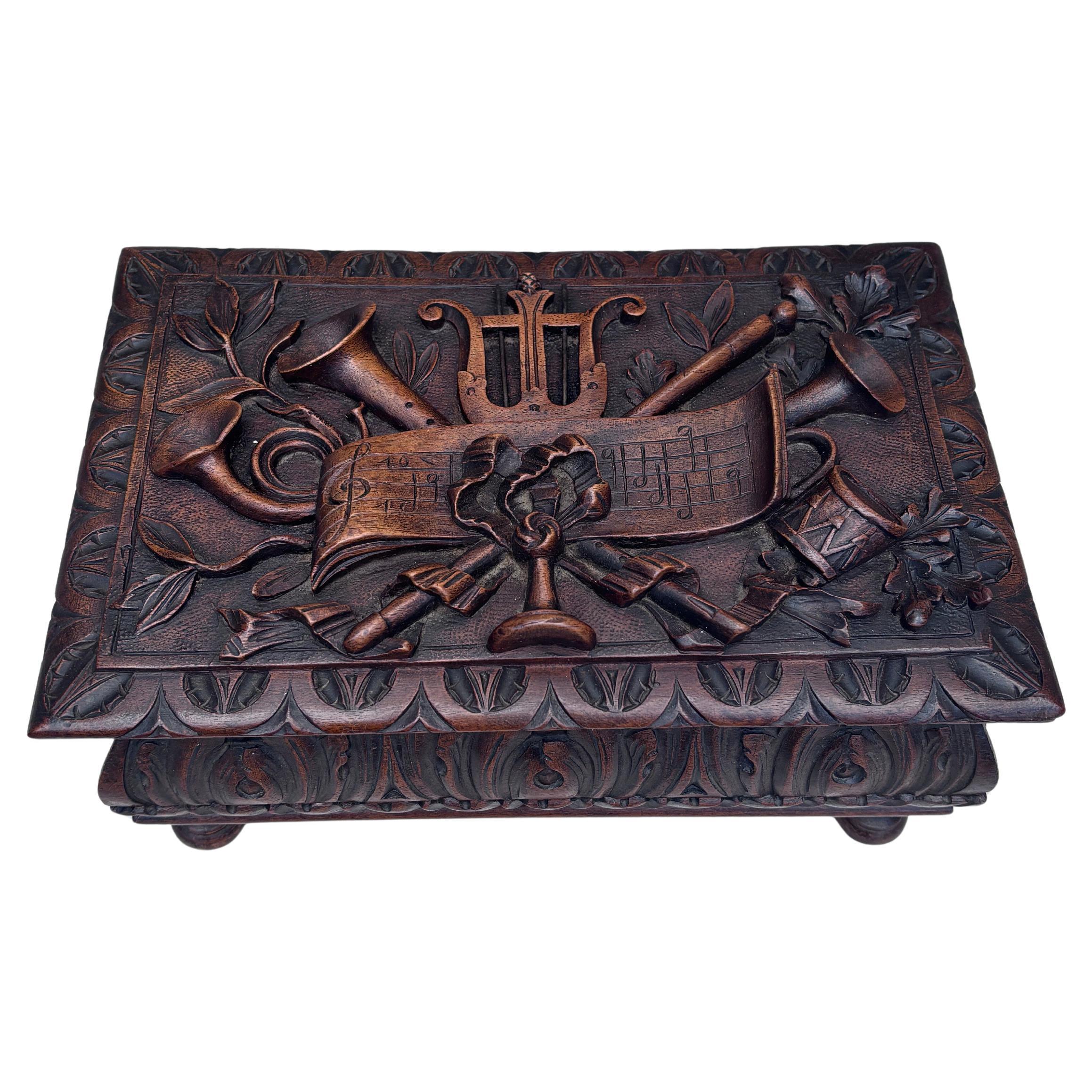 Large French Black Forest wood box, circa 1900.
11.8 by 7.3 inches , H / 5.3 inches.
Music instruments
Jewel box.