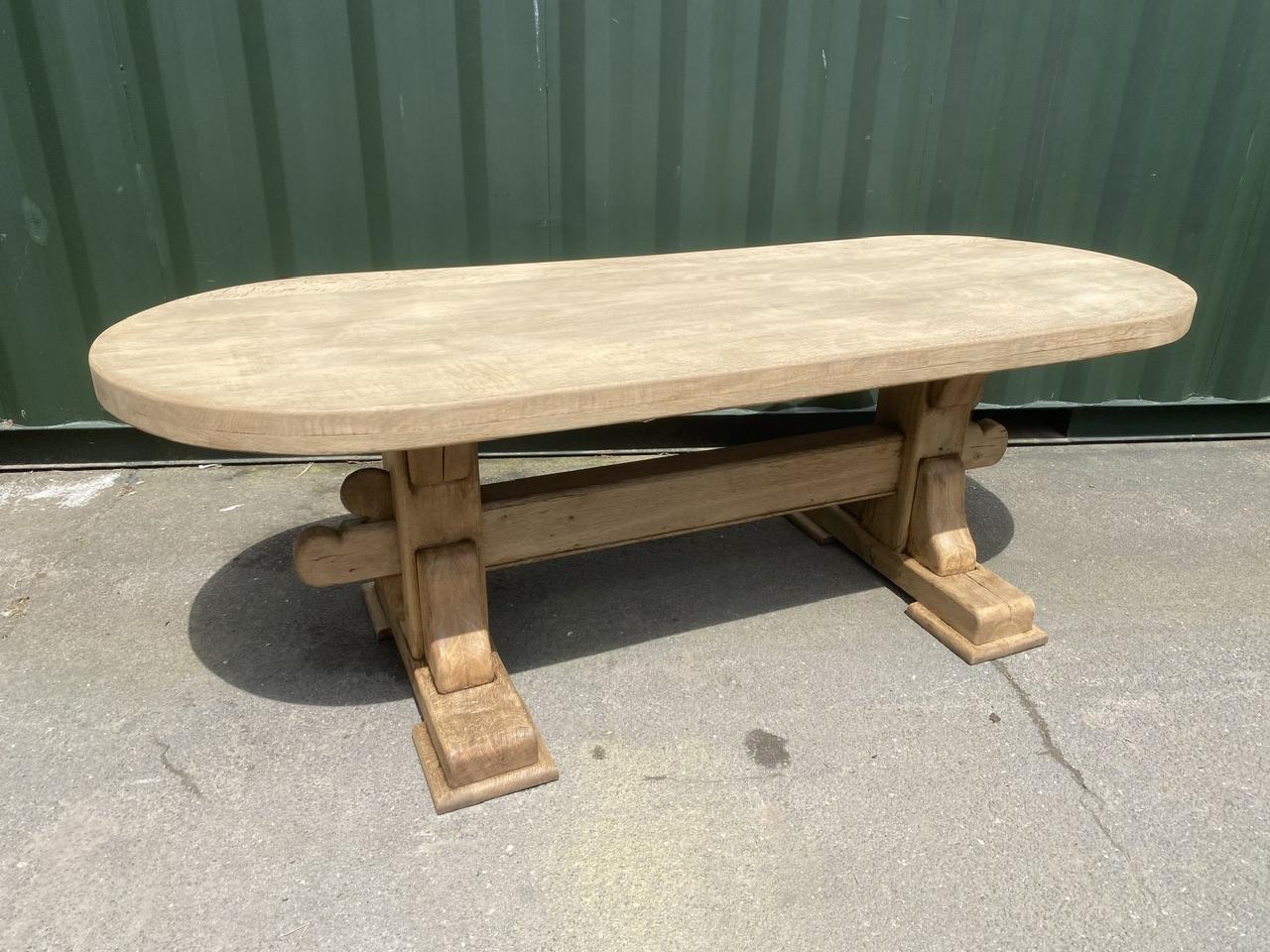 A superb example of a French Solid Oak Farmhouse Style Dining Table, excellent quality construction and a lot of Oak has been used with a super thick 7.5 cm top. The end overhang is very good and it comes fully apart if required for easy entry into
