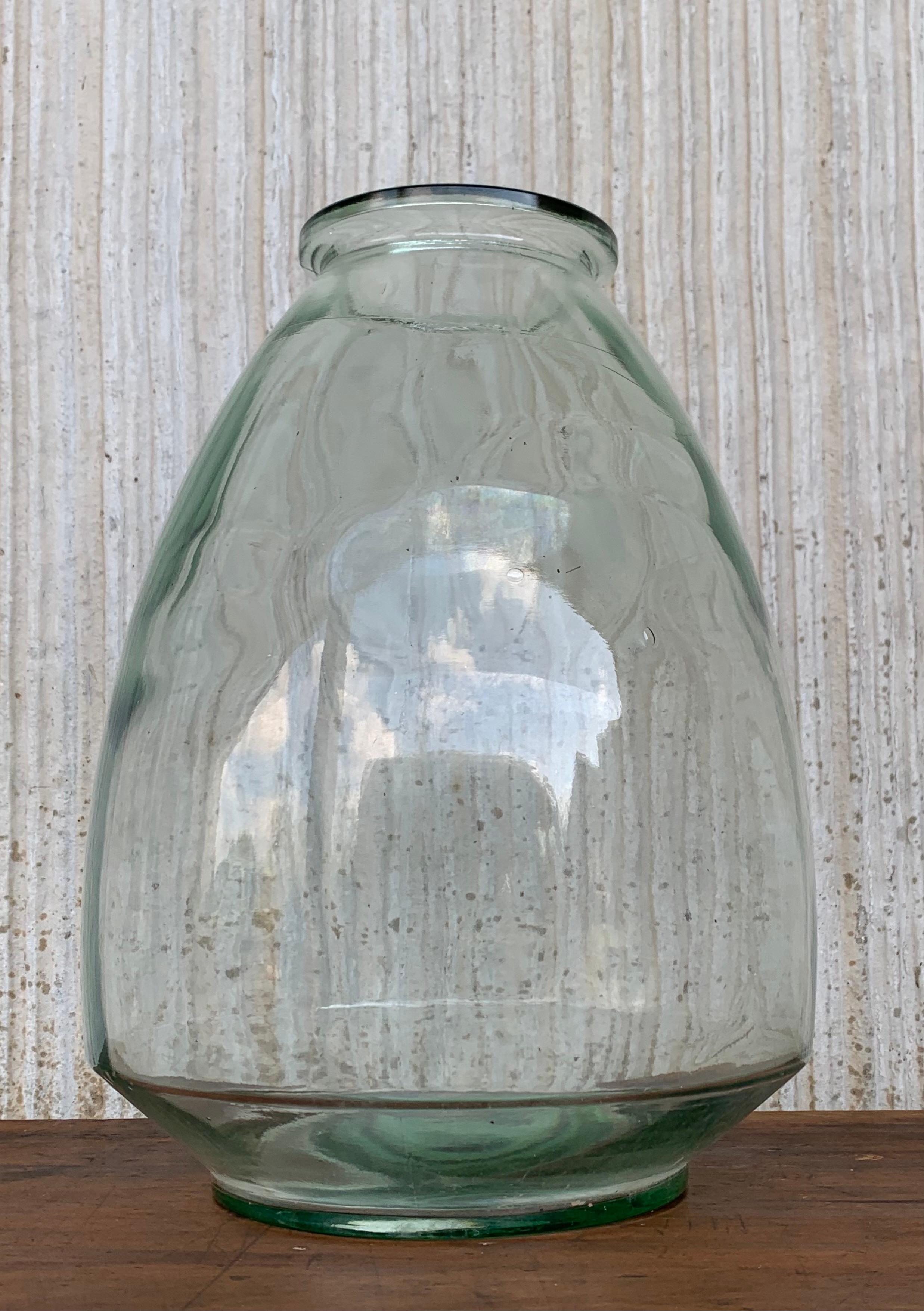 Early 1900 hundreds blown glass demijohn bottle, France. This huge outstanding vessel is tall and sturdy. It's large mouth allows the bottle to hold a large bundle of flowers as well as an abundance of liquids. The clear glass is a wonderful example
