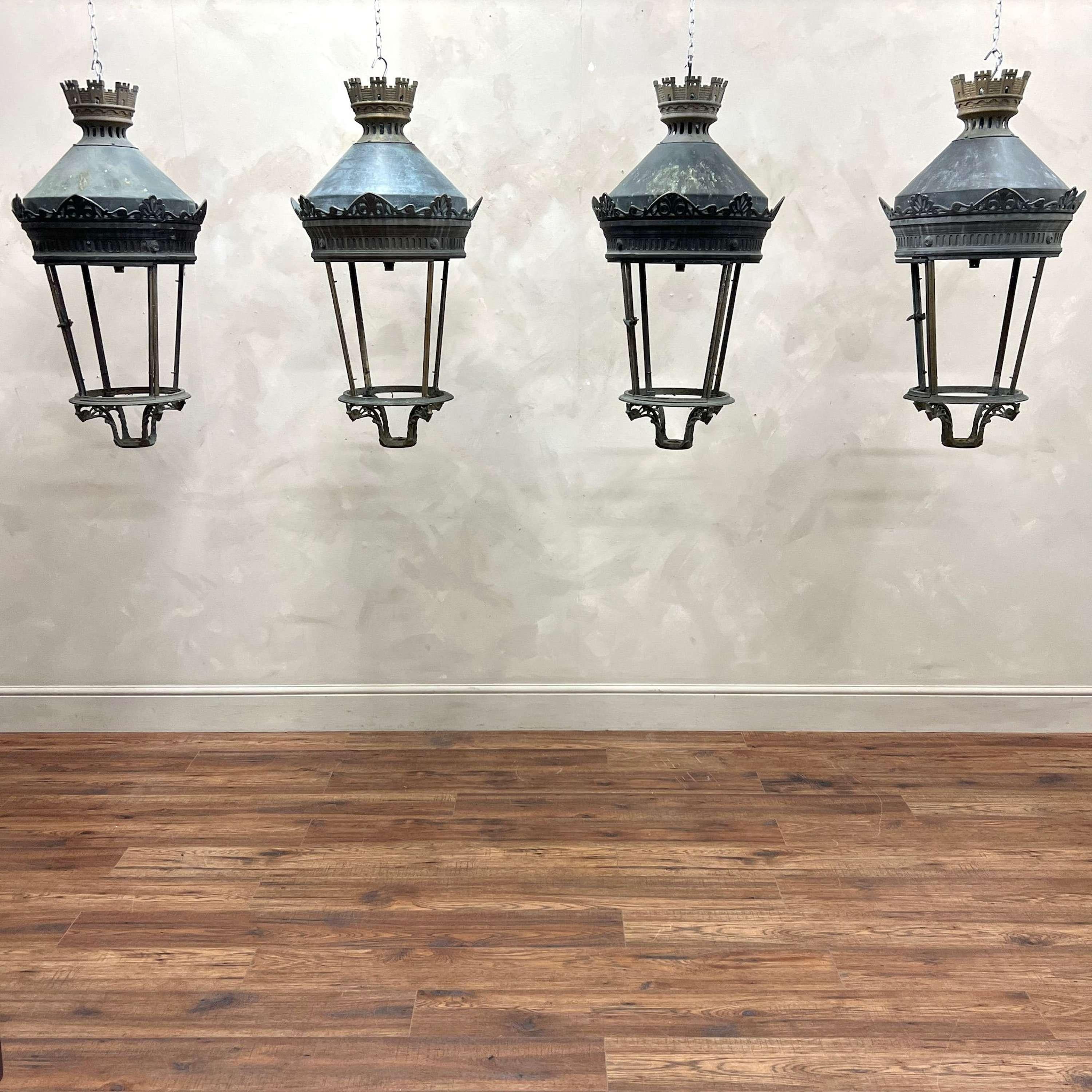Large scale Parisian street lanterns. These would have been placed on posts throughout the streets of Paris, made from brass and copper with natural weathering throughout.
Wired and tested, ready to hang. Unglazed.

France, circa 1950.

Height - 92