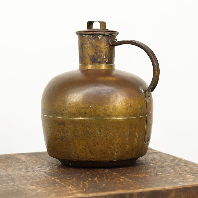 This unique antique French milk jug, also known as a canne à lait, was used in the 19th century to transport milk from the farm to the house or to the market. It is a handmade piece, crafted from brass, and exceptionally large.

What makes it unique