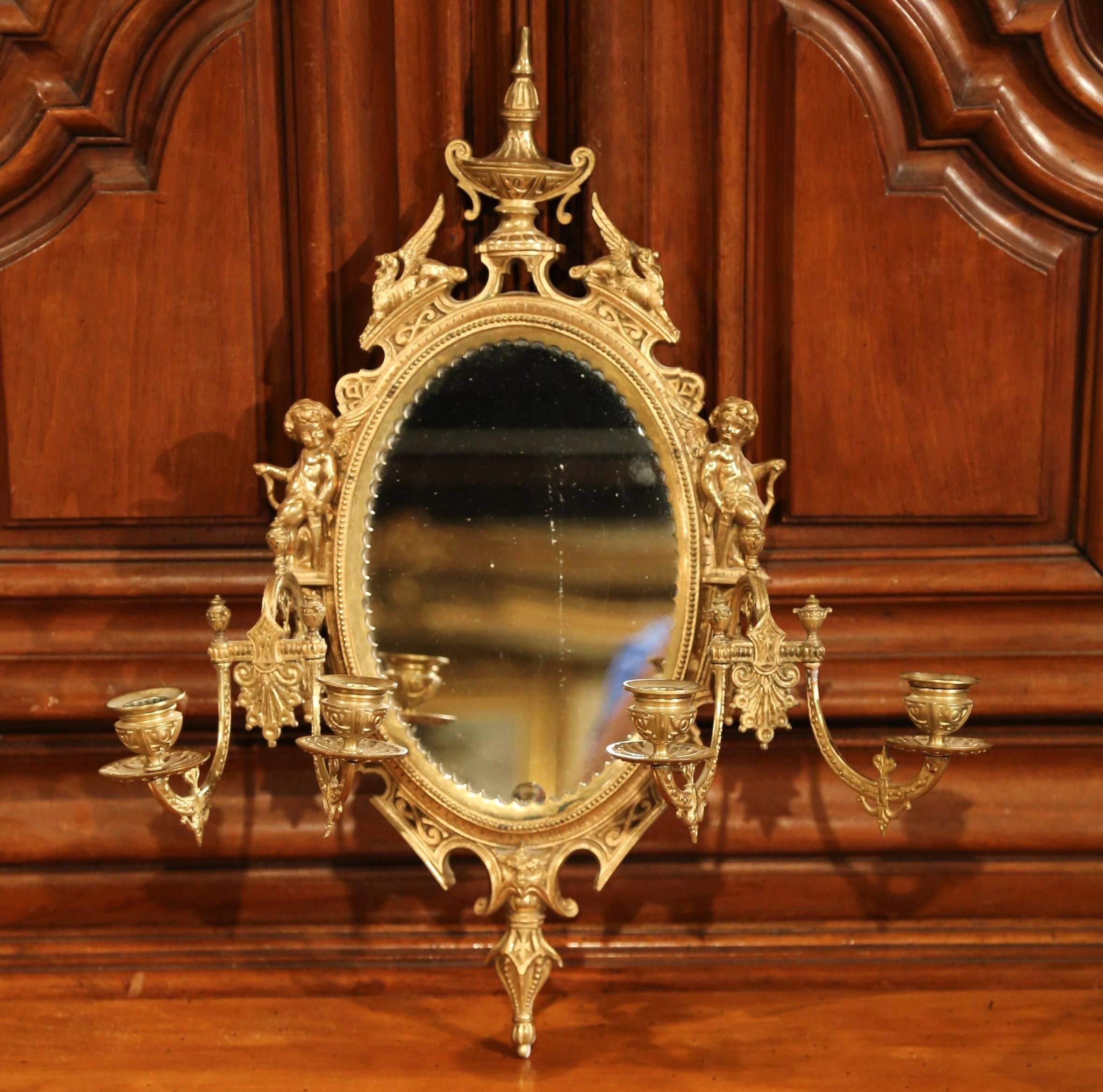 Large French Bronze Four-Light Sconce with Oval Centre Mirror and Cherub Decor In Excellent Condition In Dallas, TX