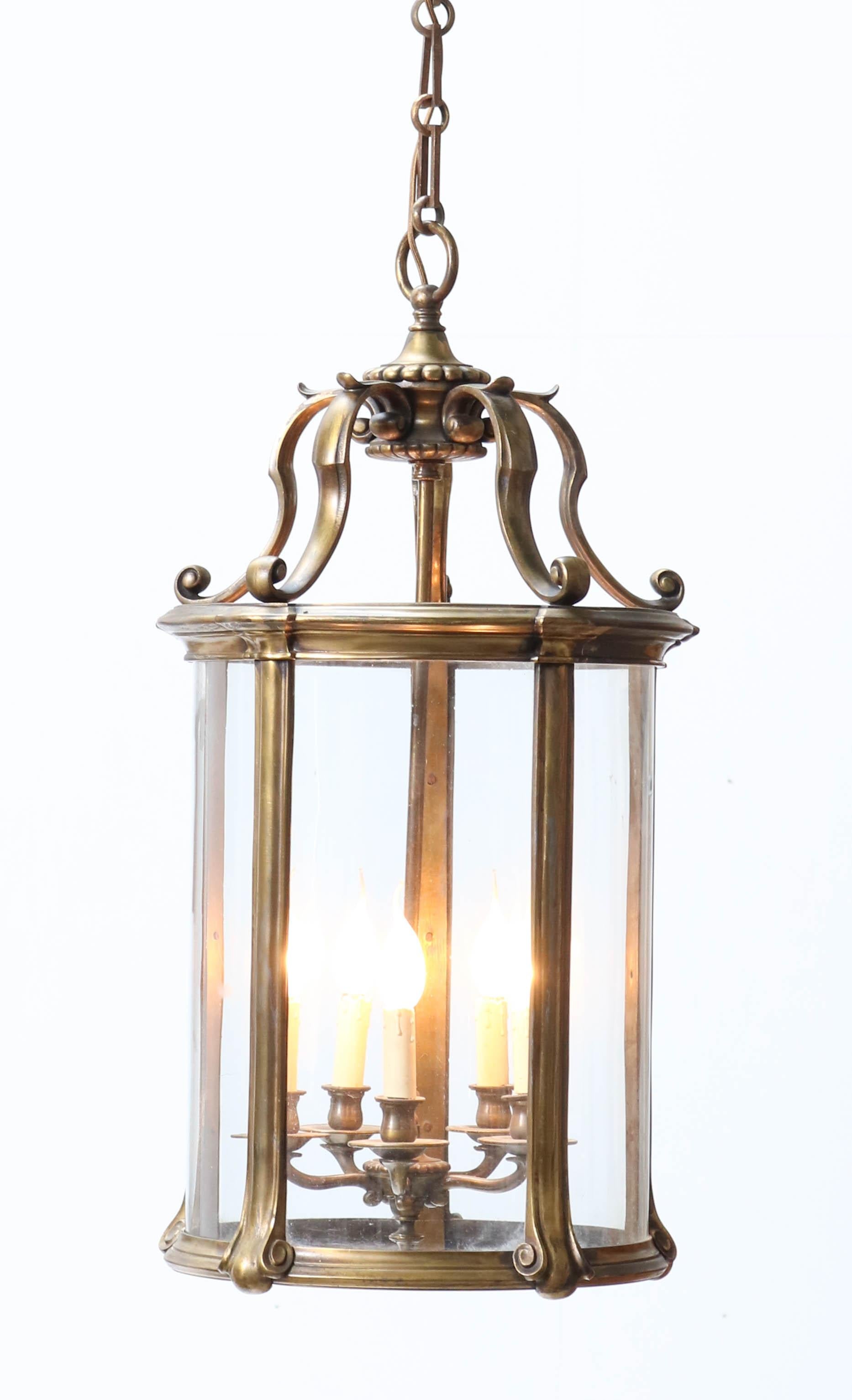 Magnificent and large Louis XV style lantern.
Striking French design from the 1900s.
Solid bronze six sided cage with six original glass shades.
Extra large chain which can be shortened.
Rewired with six sockets for E-27 light bulbs.
In very