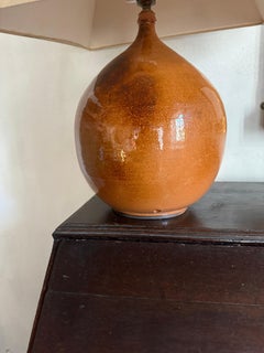 Large French burnt orange glazed ceramic lamp.