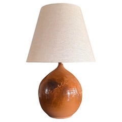 Large French burnt orange glazed ceramic lamp.
