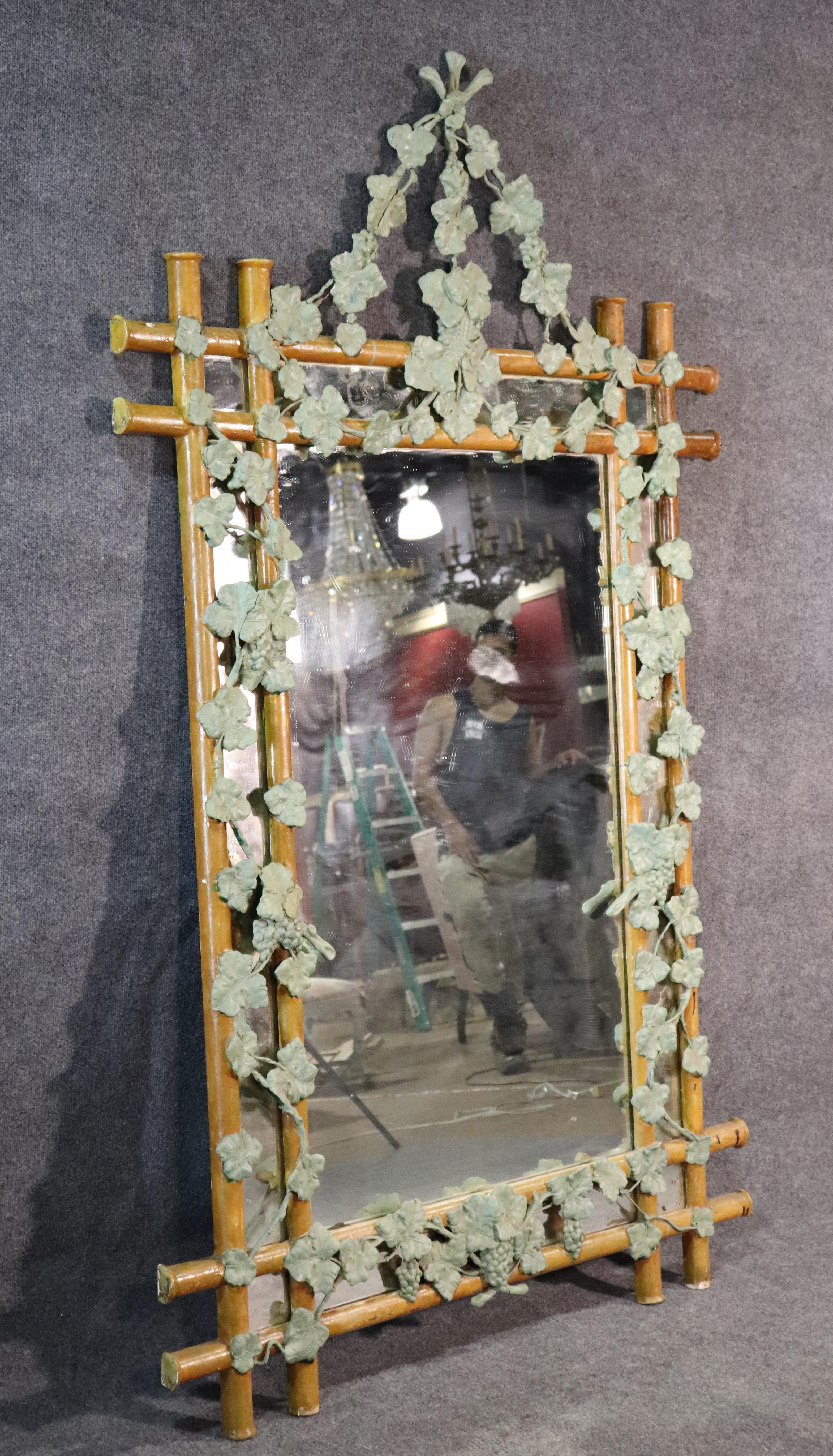 This is a rare French made faux bois mirror with beautiful green painted ivy surrounding the frame. This is a sophisticated mirror with incredible detail and great patina.
Measures: 82 tall x 48.5 wide x 1.75 inches deep.