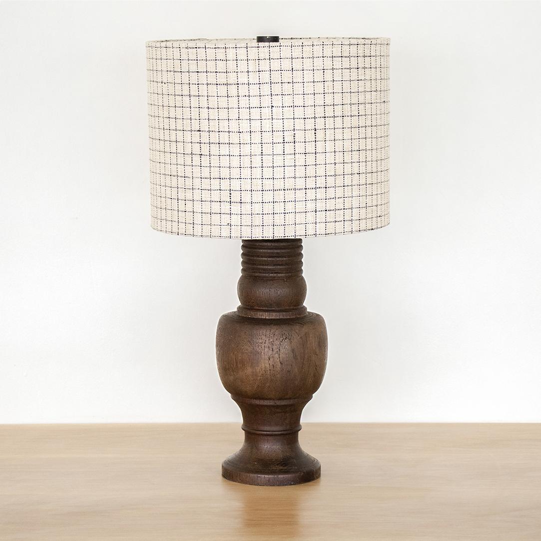 Vintage carved wood table lamp with from France, 1930's. New drum shade with top diffuser in a soft greige linen plaid fabric. Base has original wood finish and newly rewired. 


