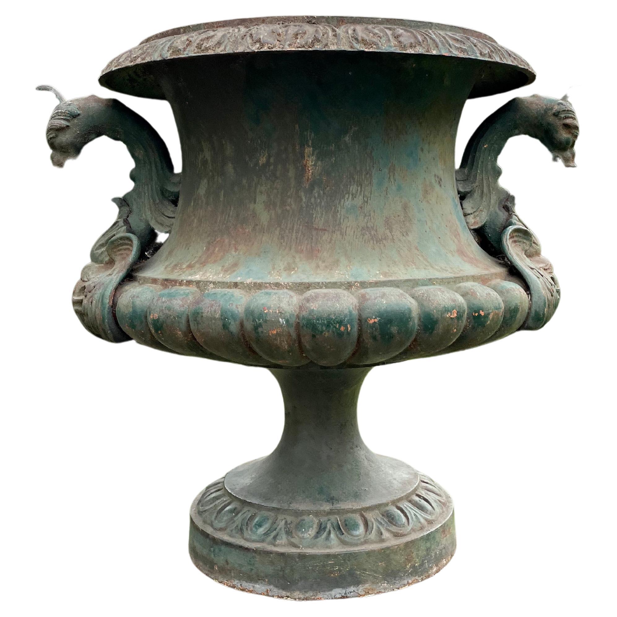 We are great fans of Alfred Corneau urns and this is a stunner! In luscious original and faded blue/green paint and with prominent griffin handles, a demi-lobed body and decorated rim and foot, it is in perfect antique condition. Large enough to