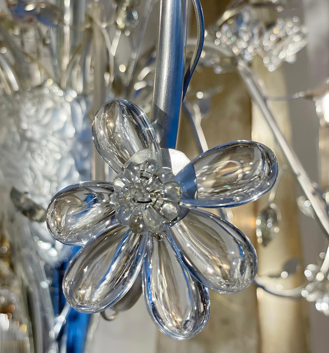 A circa 1950's French six-arm silver-leafed chandelier with molded glass leaves, crystal flowers and mercury glass vase body.

Measurements:
Height of body: 27