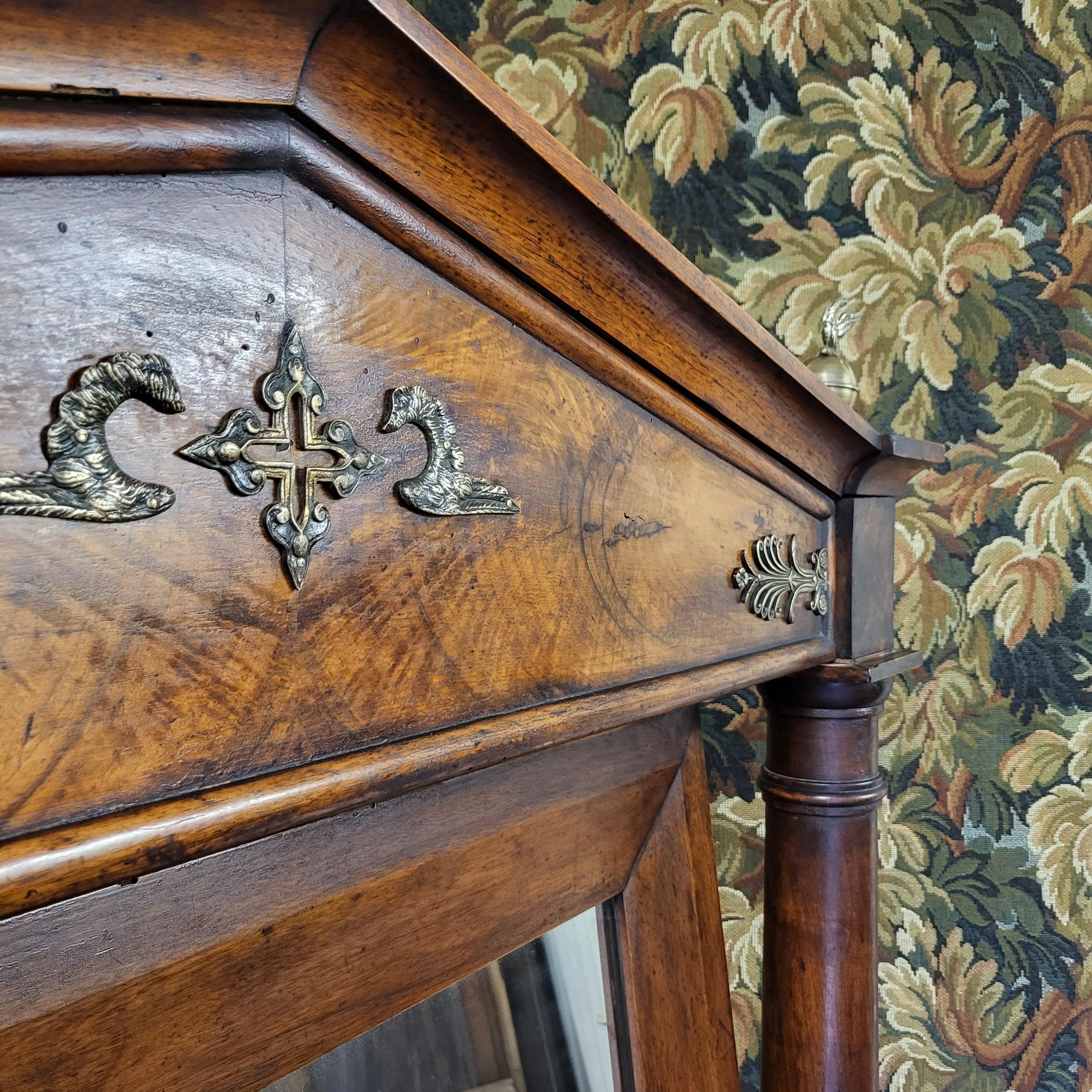 Hutton-Clarke Antiques is pleased to offer a country house oversized cheval mirror from the Empire period in France, likely originating from a large chateau. This exceptional piece features a pedimented top with mounts, below are two columns with
