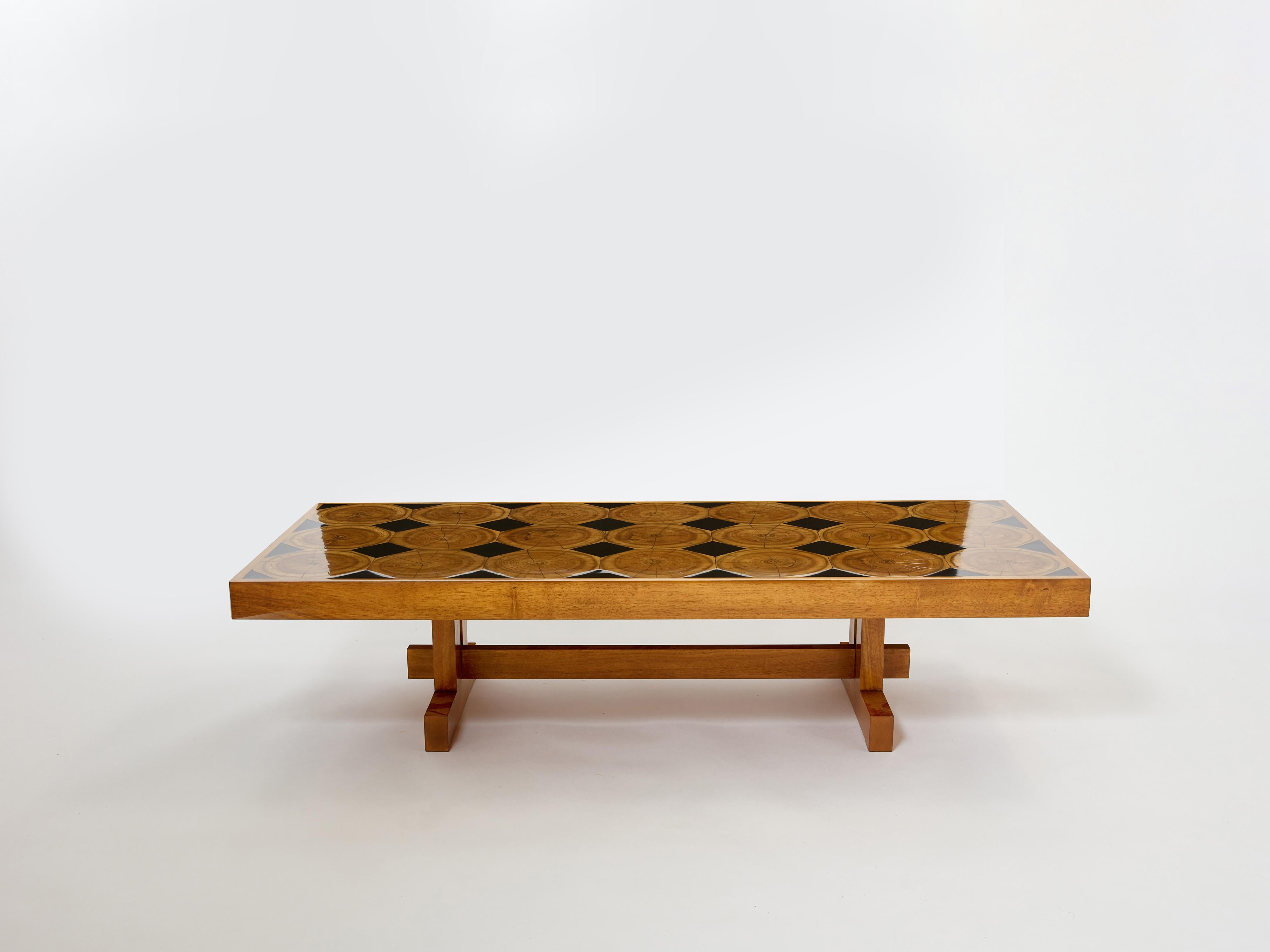 This large modernist French coffee table made in solid oak wood is sure to add an element of French brutalism to any living room. It was designed and produced in France by an unknown cabinetmaker in the 1960s. It features a large slick petrified
