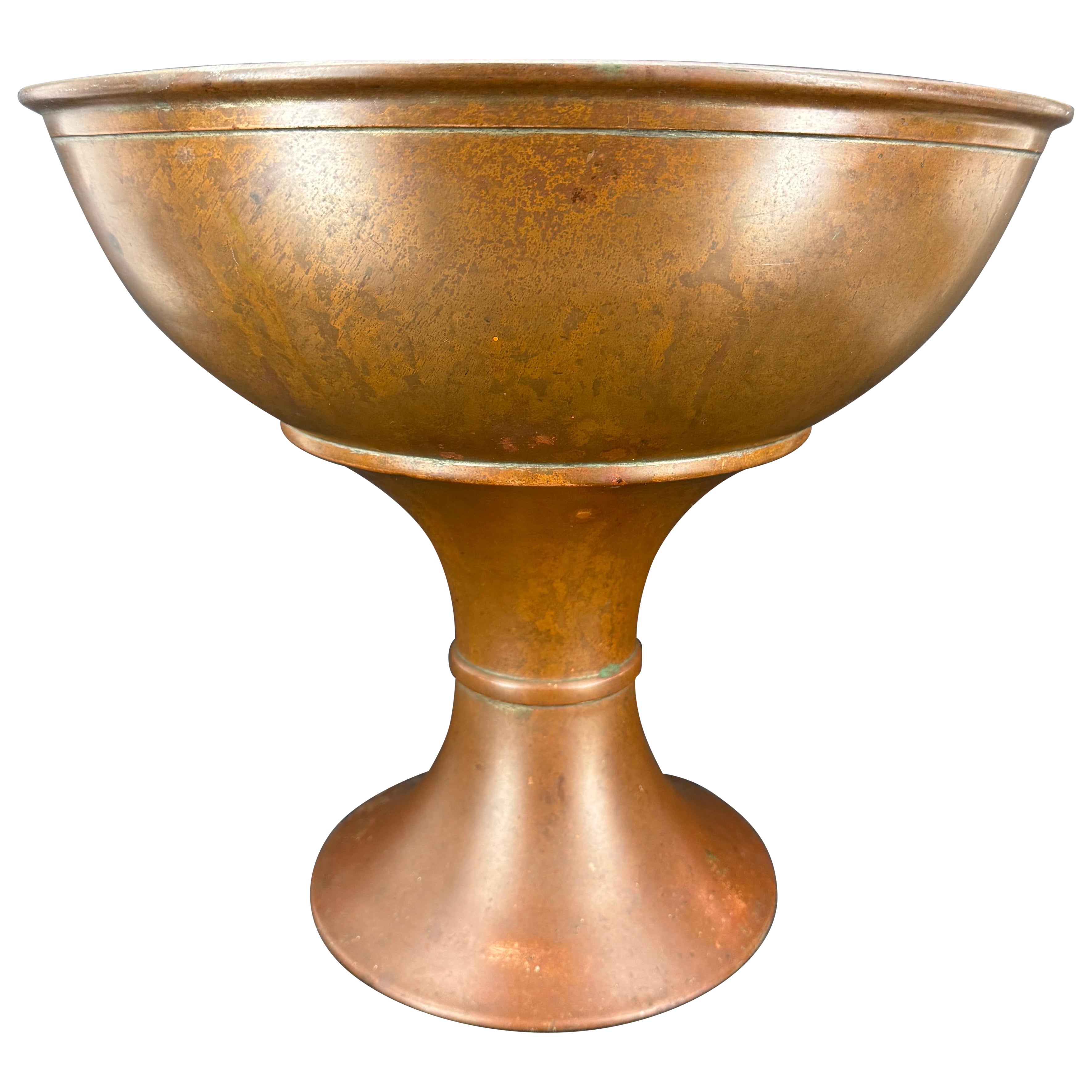 A large vintage copper footed champagne bucket from the early part of the 20th Century. This French wine-champagne cooler has kept its old patina and elegance throughout the years. This large cooler can easily keep three or four bottles chilled. We