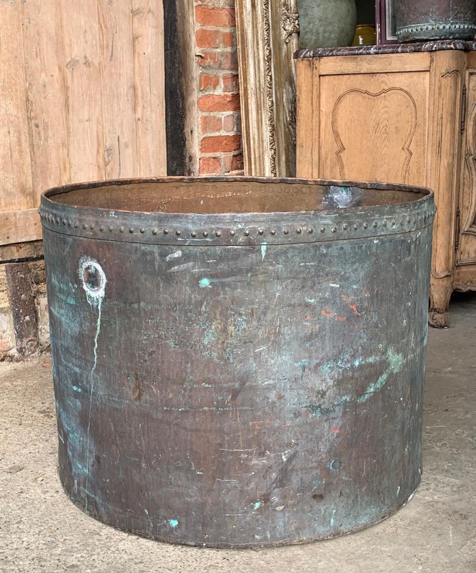 A very large antique French copper planter with rivets and a nice verdigris colour. This would have originally been part of a distillery but now makes a wonderful planter. It would make an ideal planter for a tree.