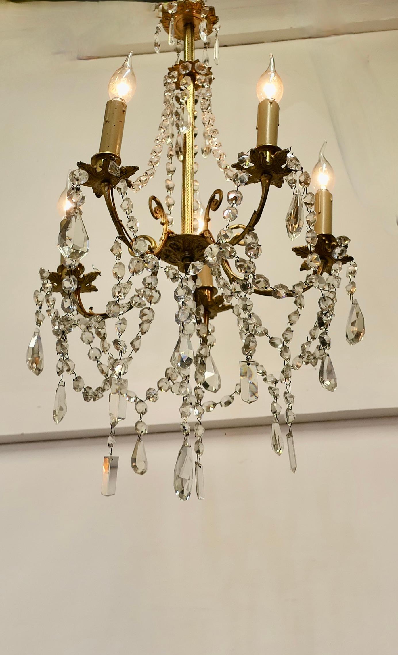 Large French Crystal and Brass 5 Branch Chandelier    In Good Condition For Sale In Chillerton, Isle of Wight